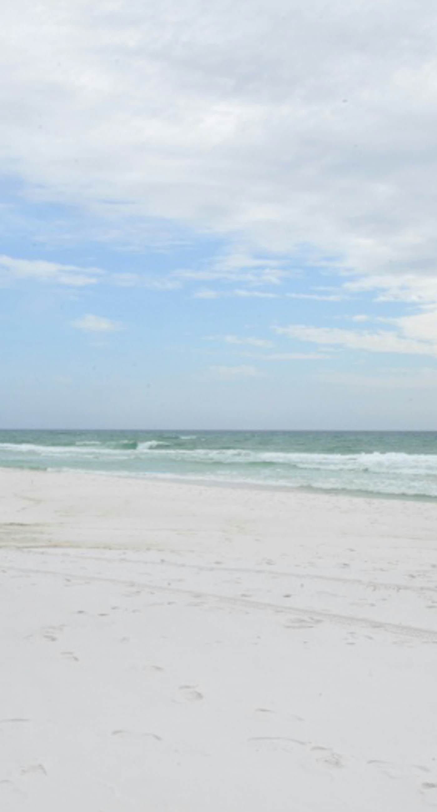 Gorgeous beachfront condo with a pool & private beach access