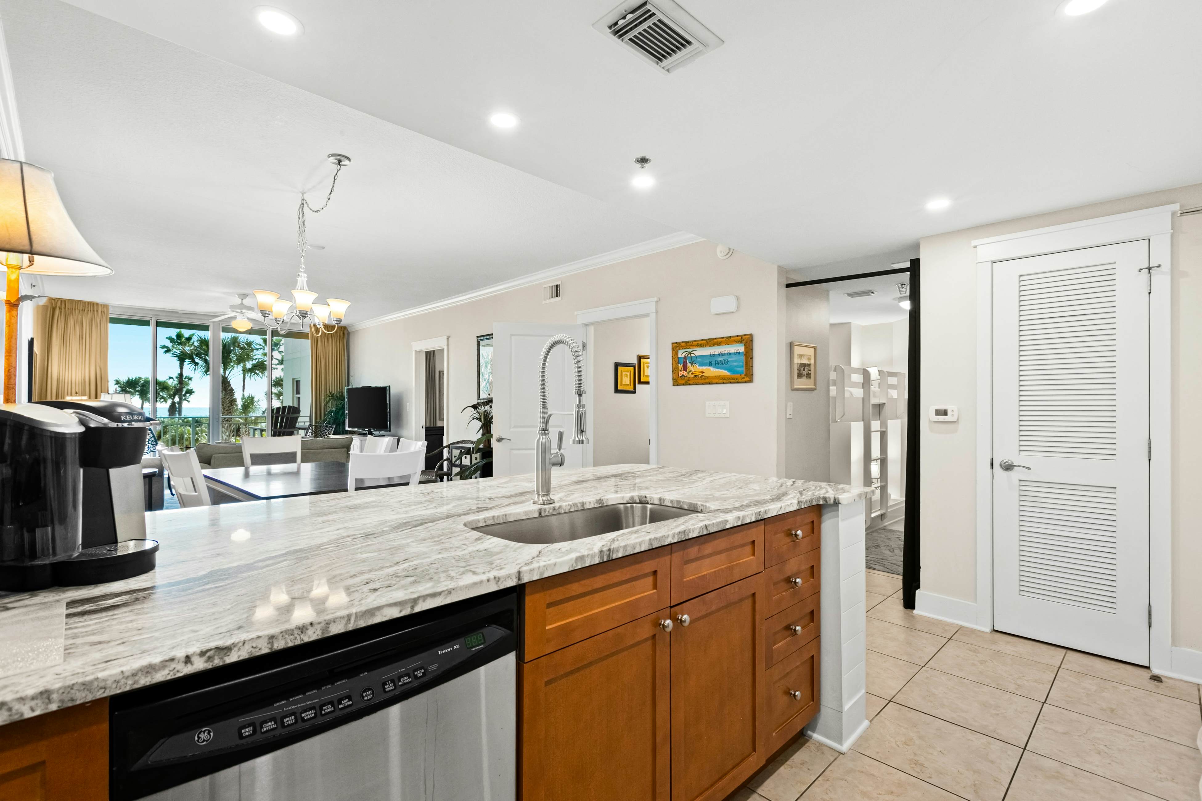 Second floor bright & Spacious condo with resort amenities, ocean views, & W/D