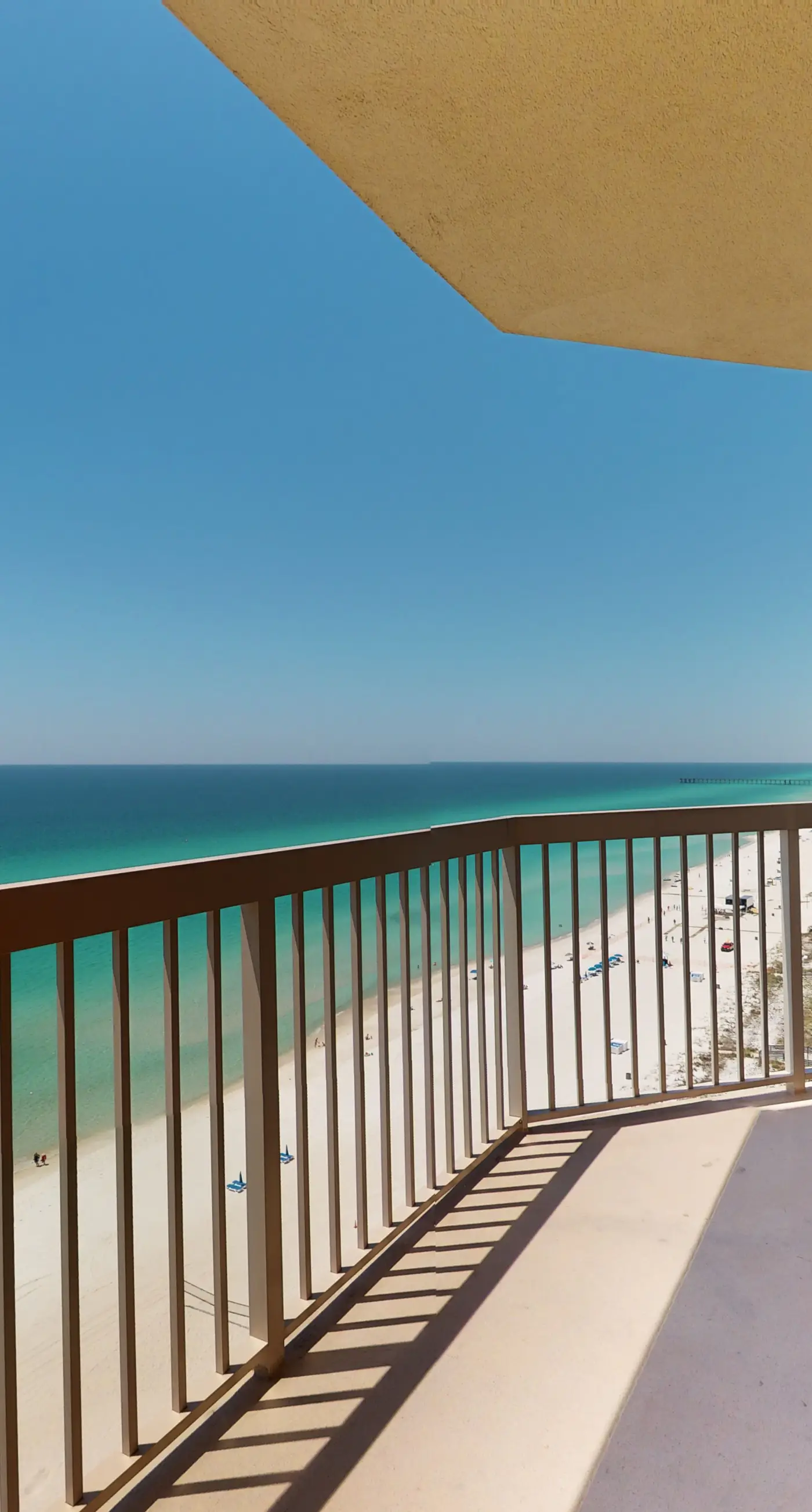 Tropical-themed 17th-floor condo with beachfront views, pools & gym