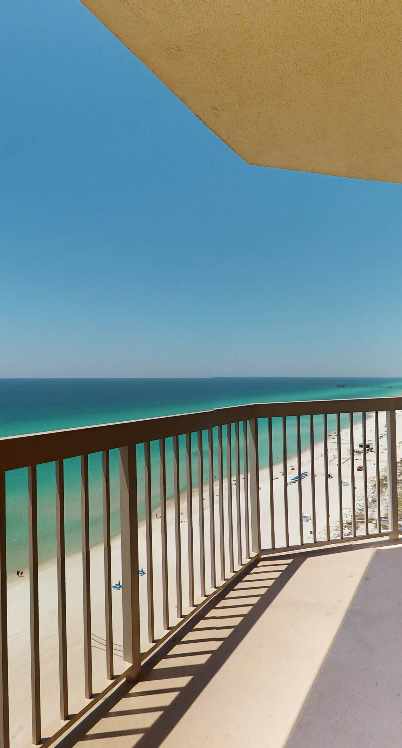Tropical-themed 17th-floor condo with beachfront views, pools & gym