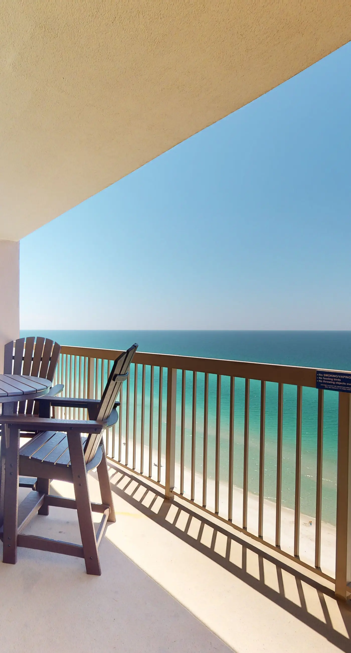 Tropical-themed 17th-floor condo with beachfront views, pools & gym