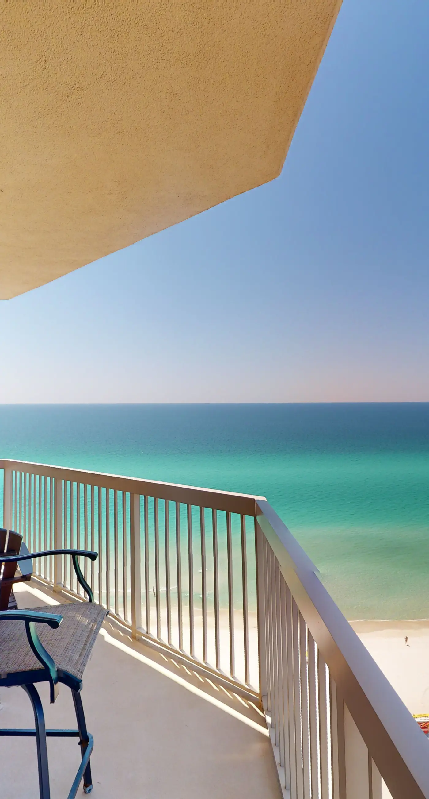Tropical-themed 17th-floor condo with beachfront views, pools & gym