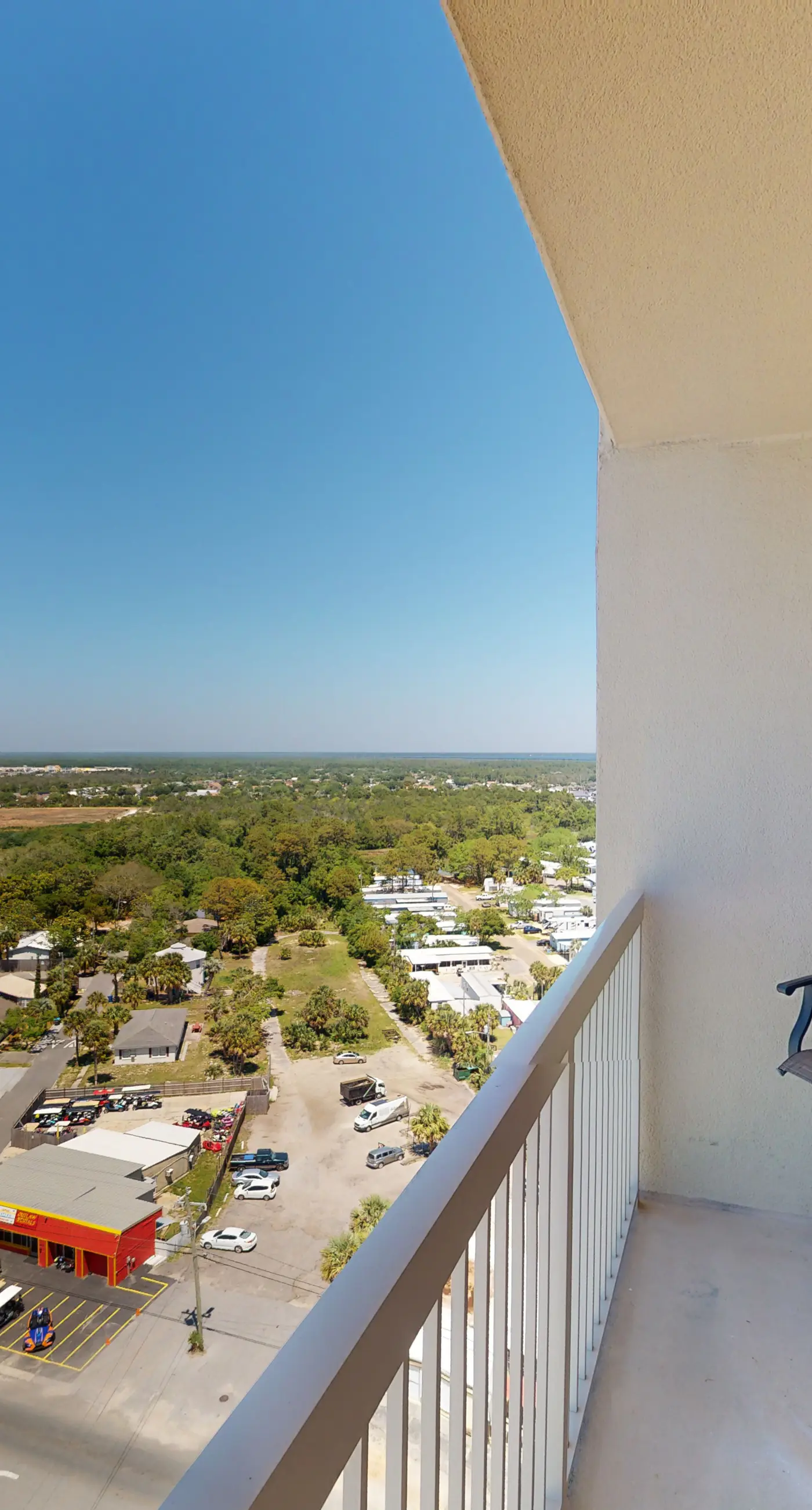 Tropical-themed 17th-floor condo with beachfront views, pools & gym