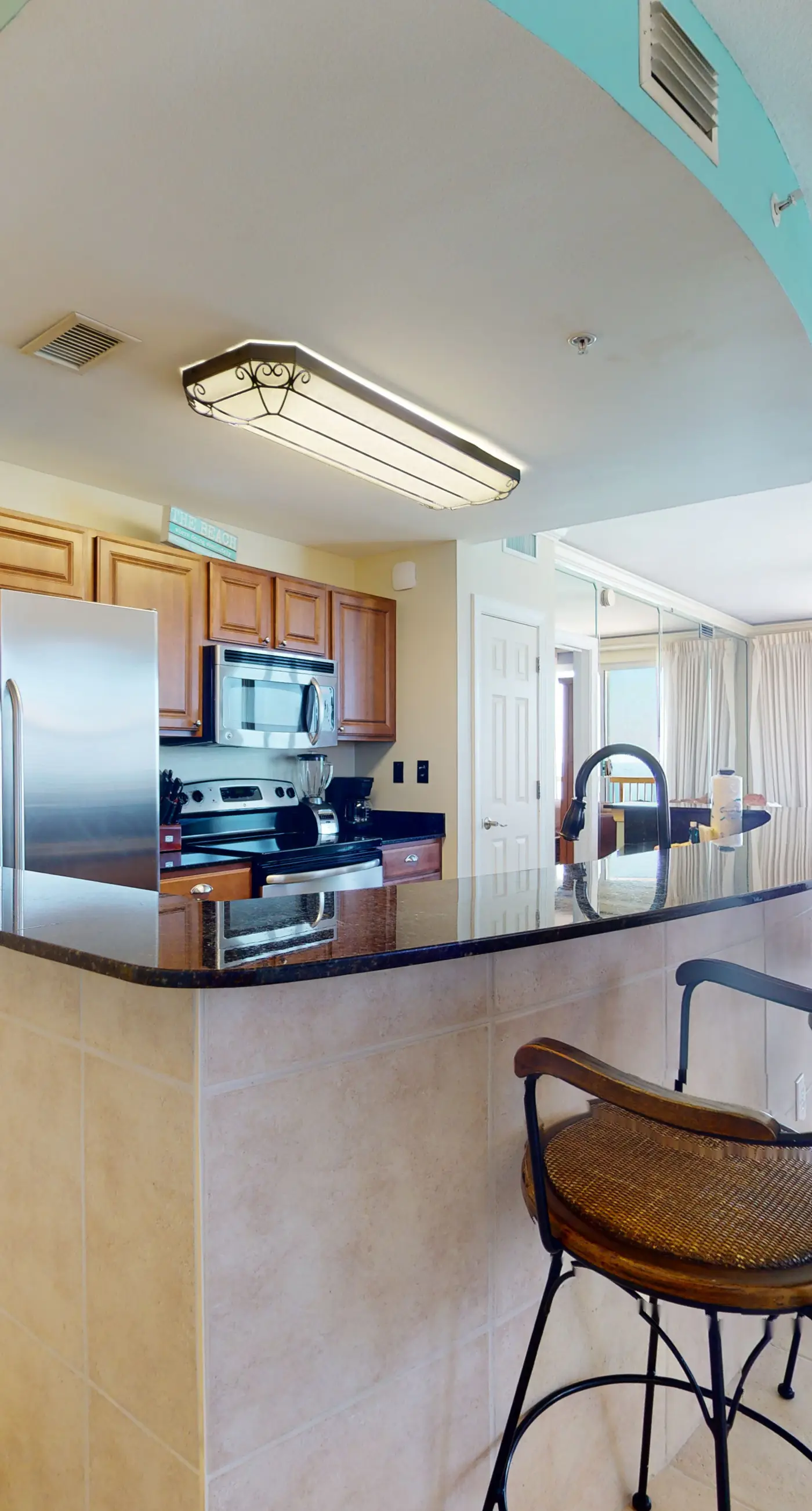 Tropical-themed 17th-floor condo with beachfront views, pools & gym