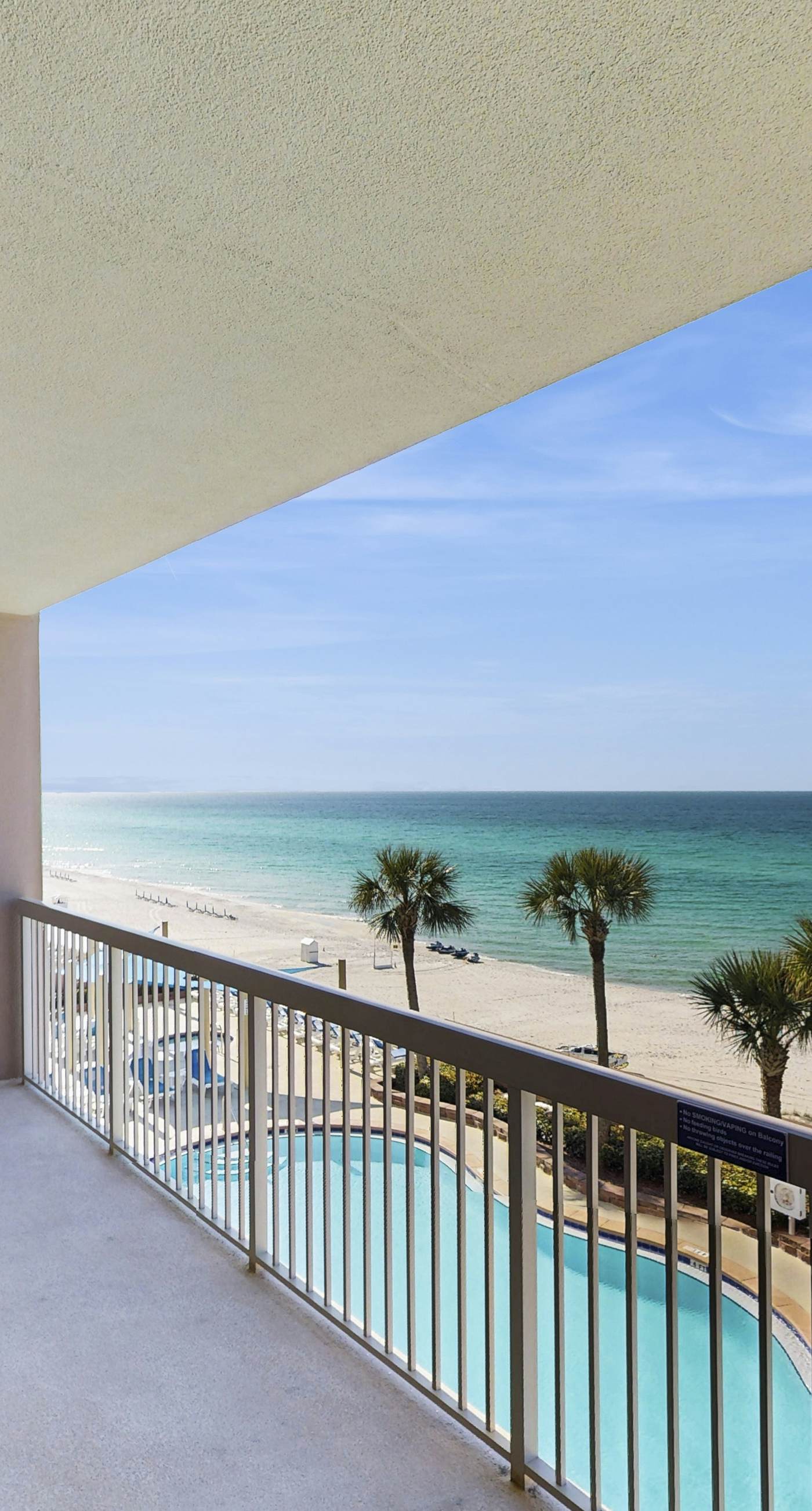 Water-view beachfront condo with pool - steps to the beach