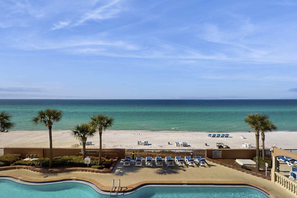 Water-view beachfront condo with pool - steps to the beach