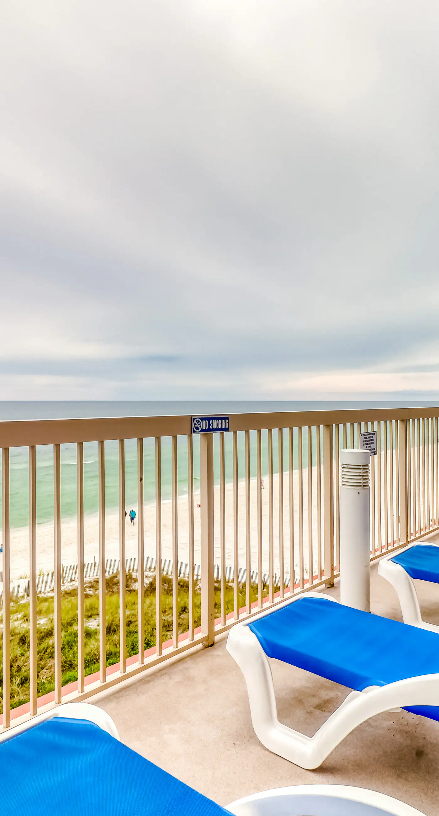 Elegant, beachfront condo with a furnished balcony, views & two pools