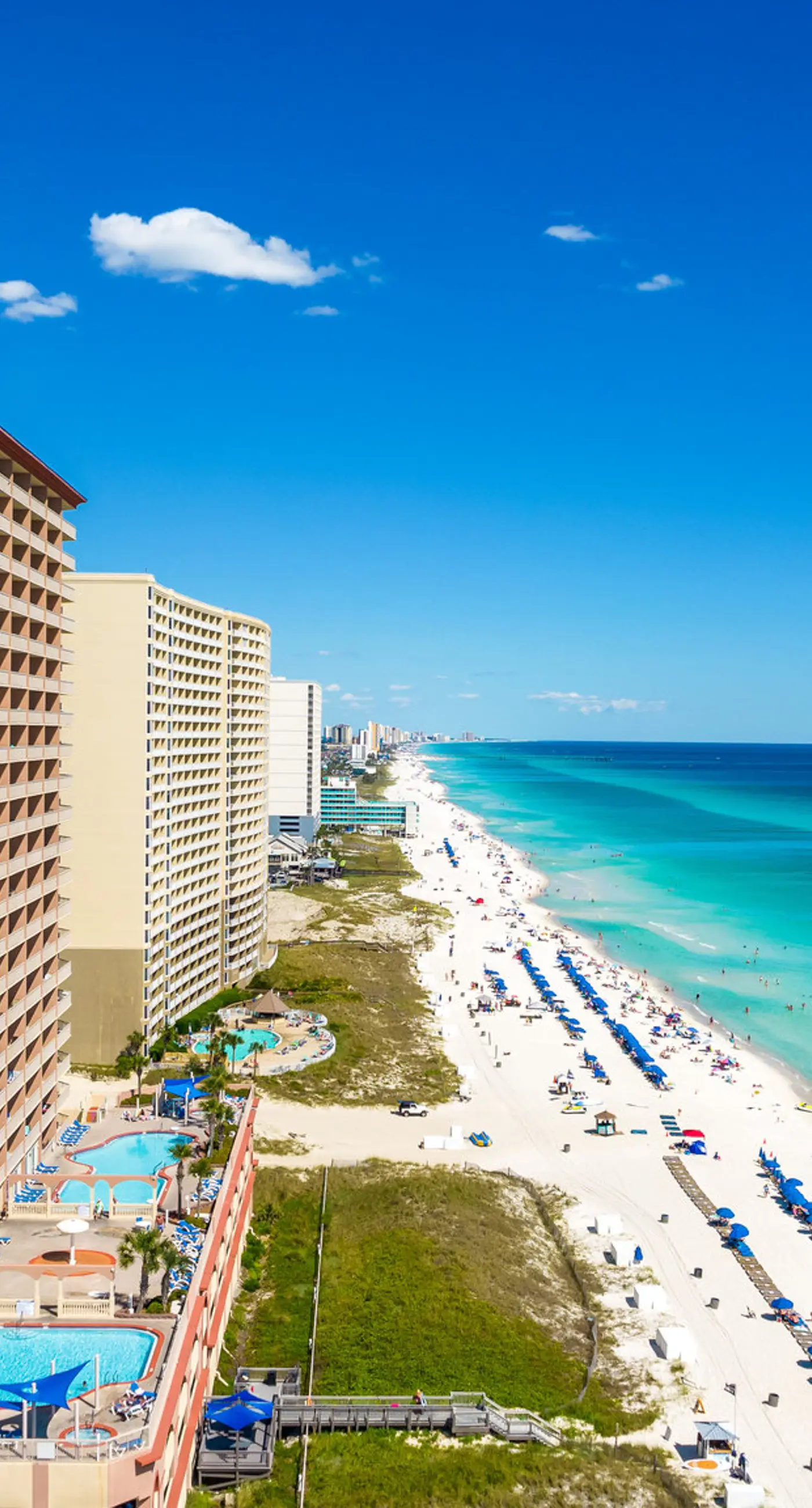 Elegant, beachfront condo with a furnished balcony, views & two pools
