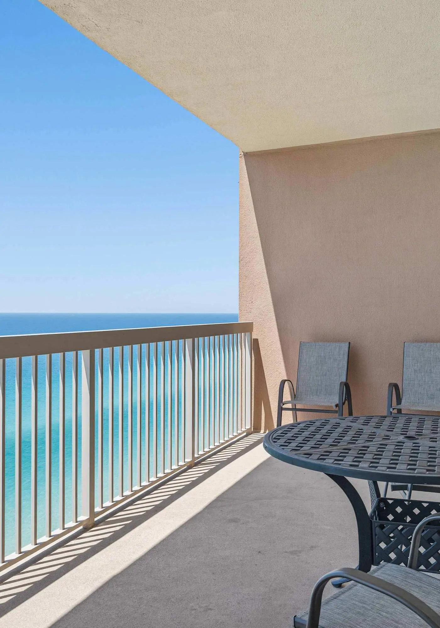 Elegant, beachfront condo with a furnished balcony, views & two pools