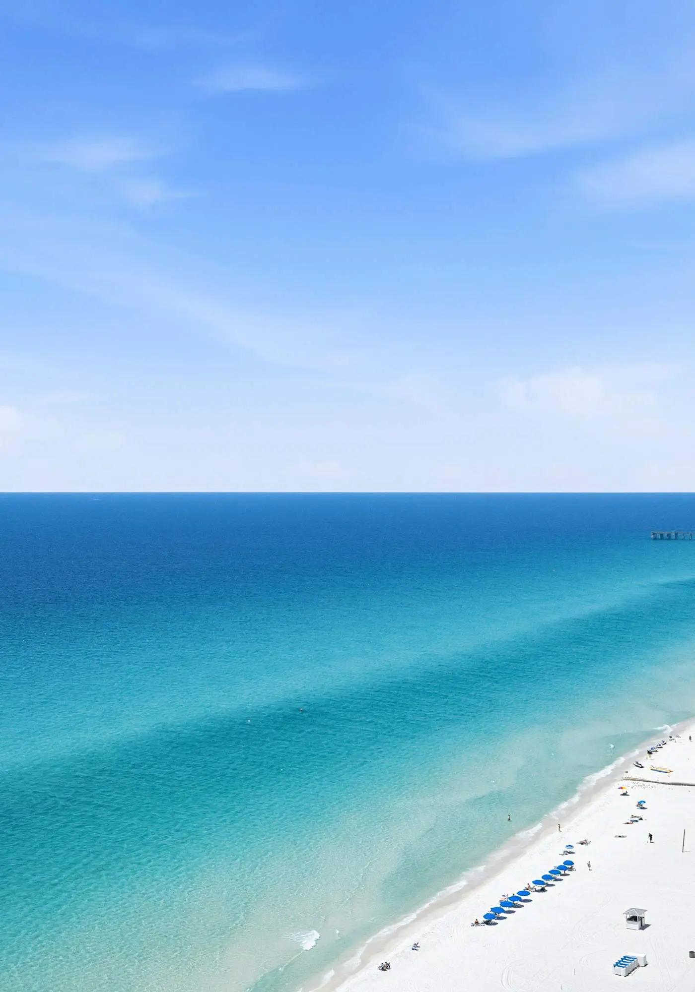 Elegant, beachfront condo with a furnished balcony, views & two pools