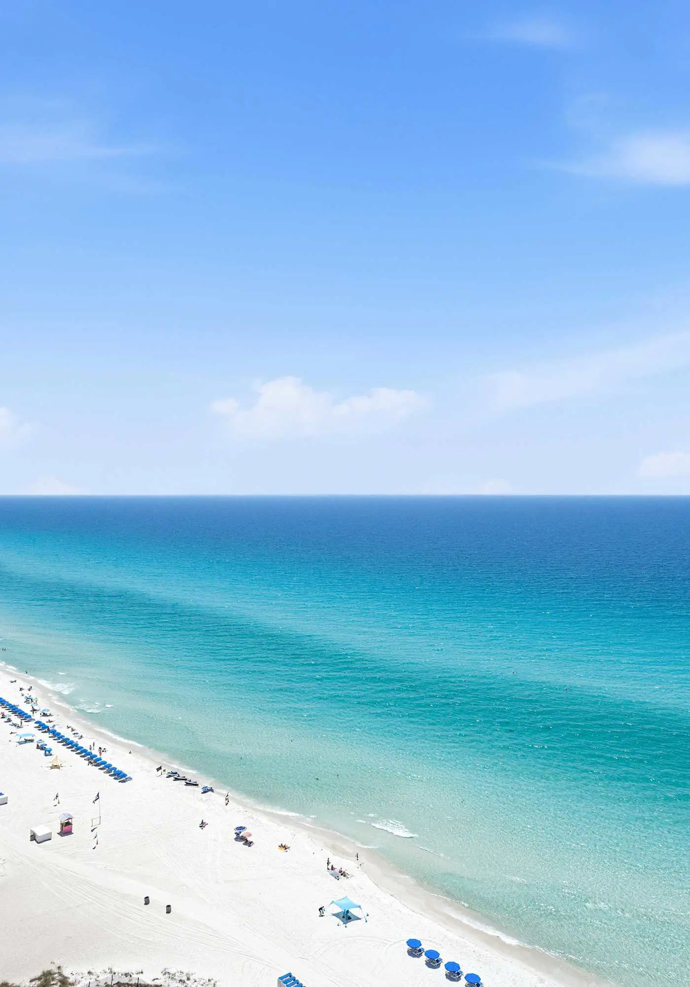 Elegant, beachfront condo with a furnished balcony, views & two pools