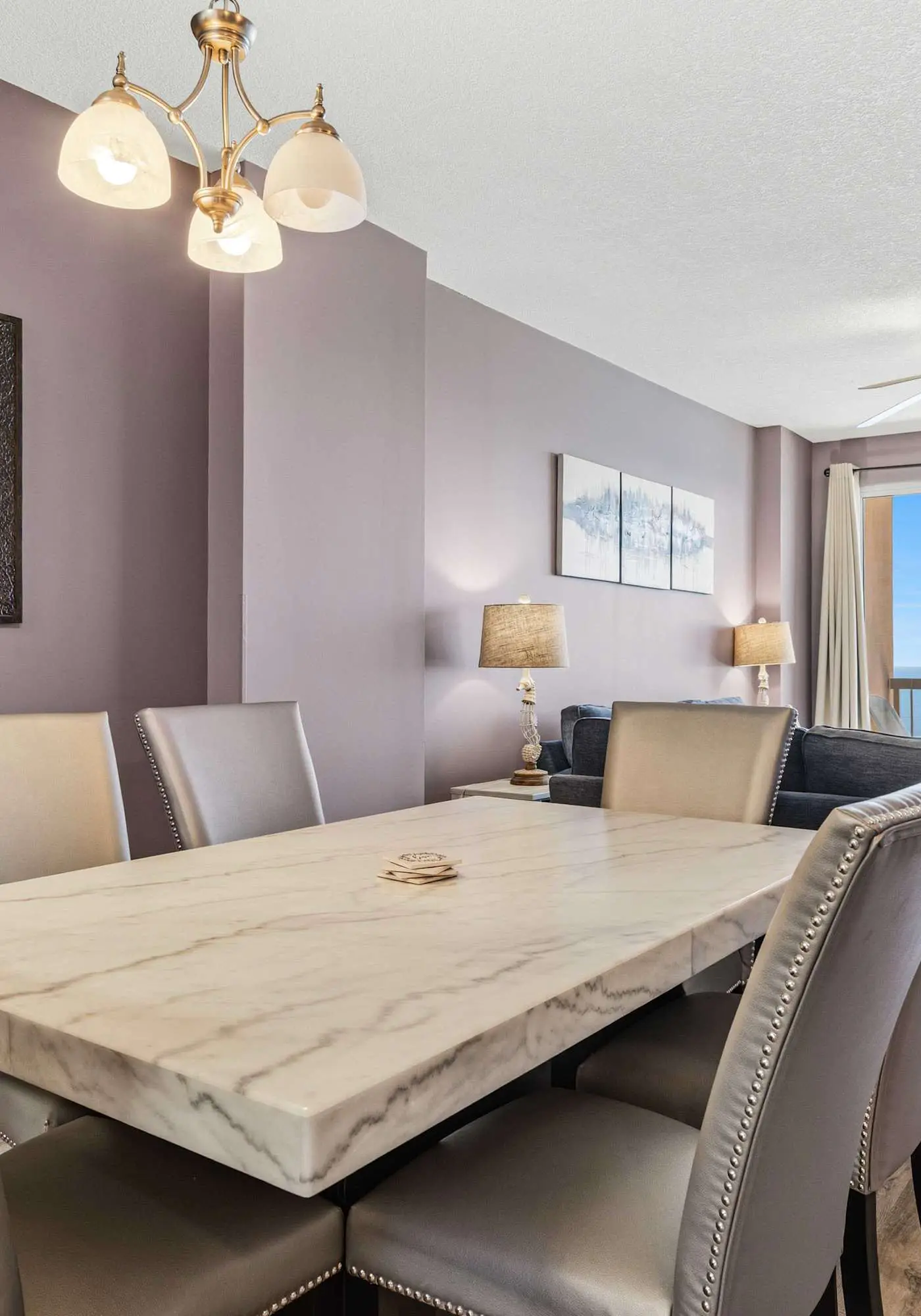 Elegant, beachfront condo with a furnished balcony, views & two pools