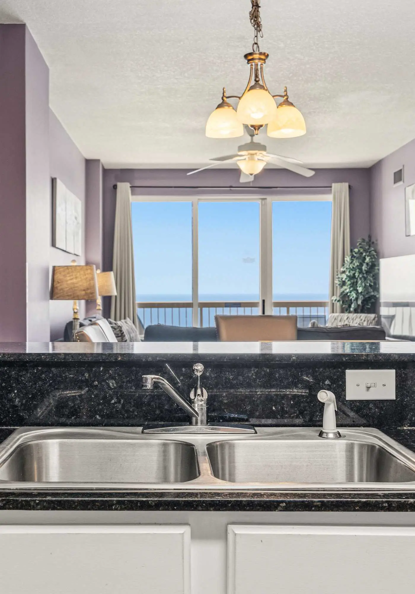 Elegant, beachfront condo with a furnished balcony, views & two pools