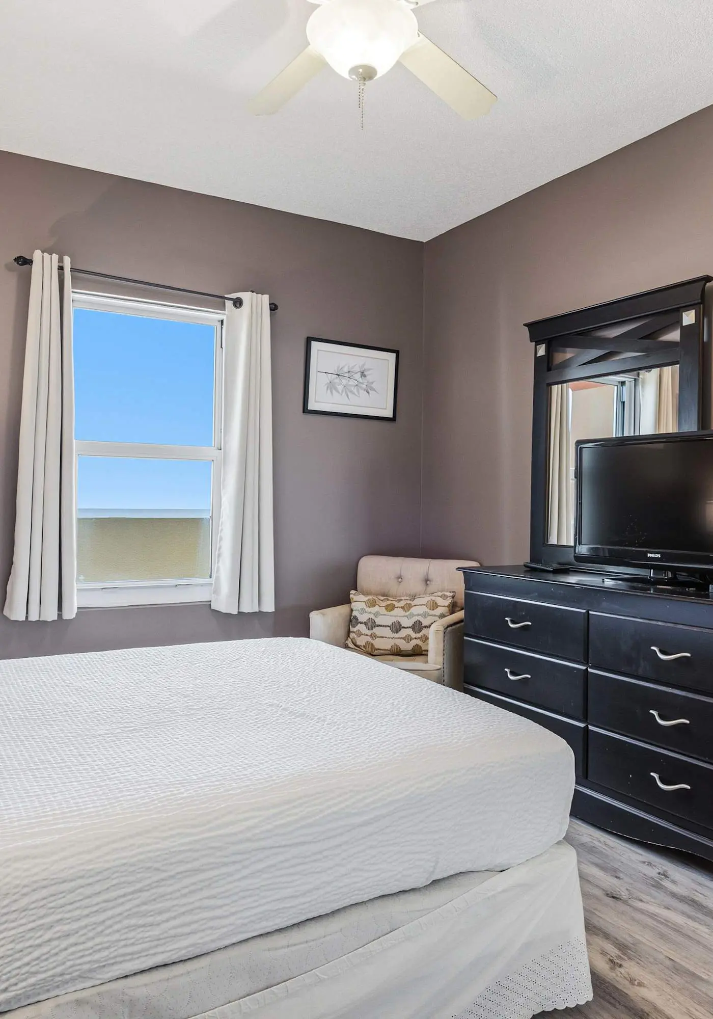 Elegant, beachfront condo with a furnished balcony, views & two pools