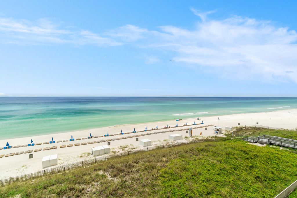 Elegant, beachfront condo with two pools, BBQ area & fitness room
