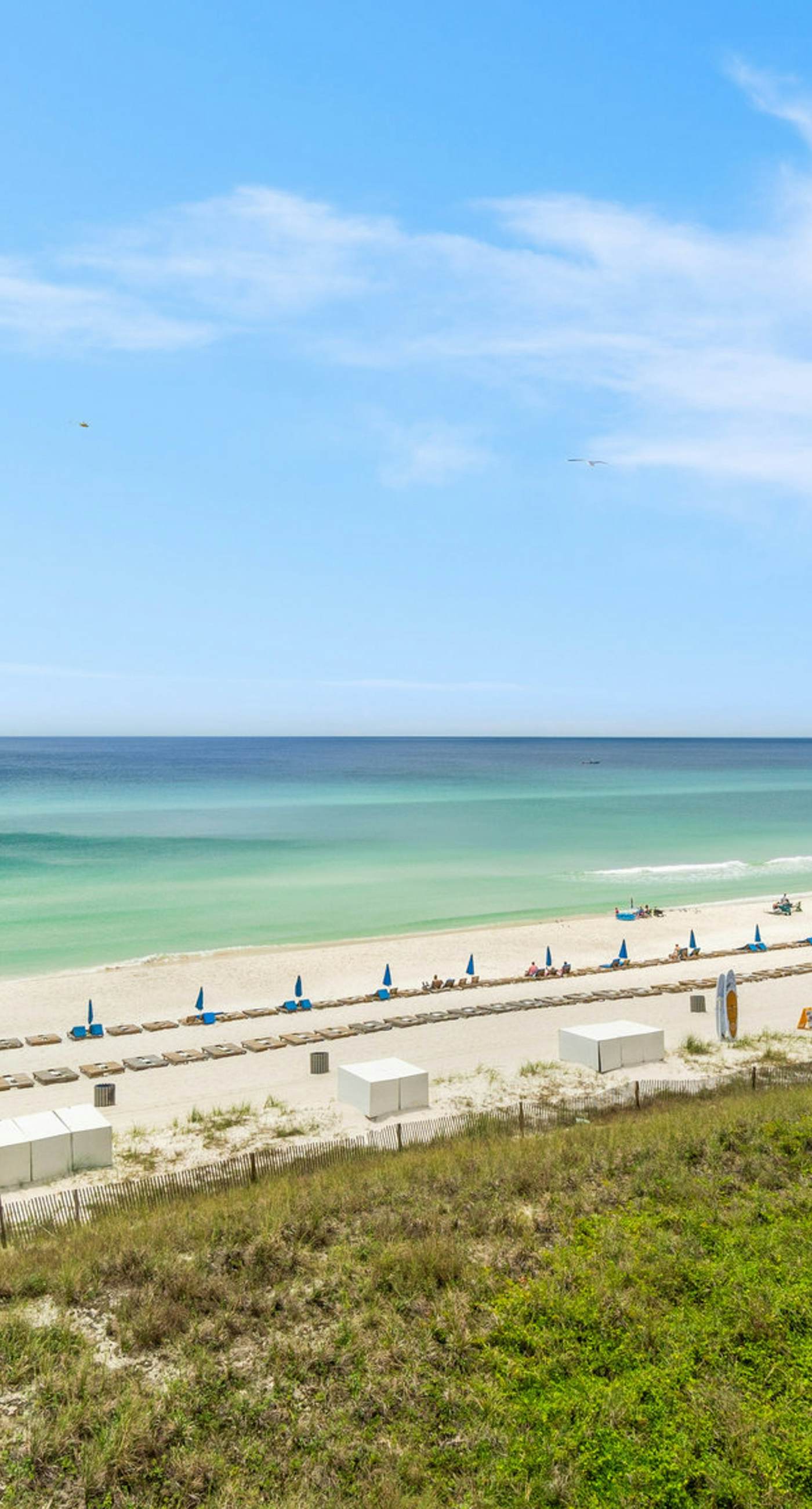 Elegant, beachfront condo with two pools, BBQ area & fitness room