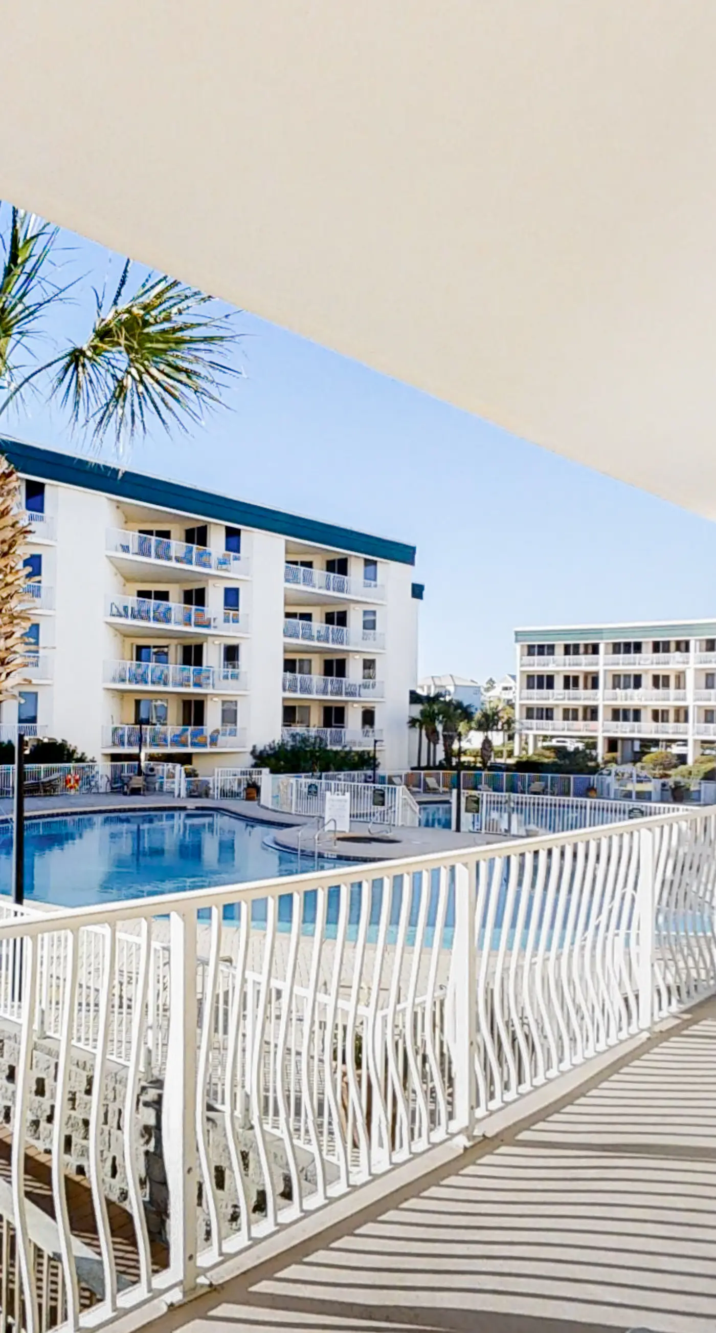 Condo with 2 stunning pools, hot tub, gym, partial Gulf view & pickleball