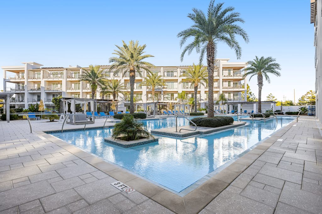 Third-floor luxury condo near beach with resort pool, gym & EV chargers