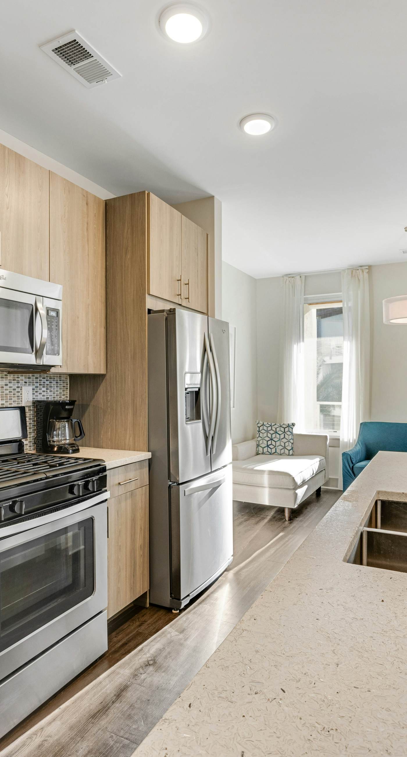 Third-floor luxury condo near beach with resort pool, gym & EV chargers