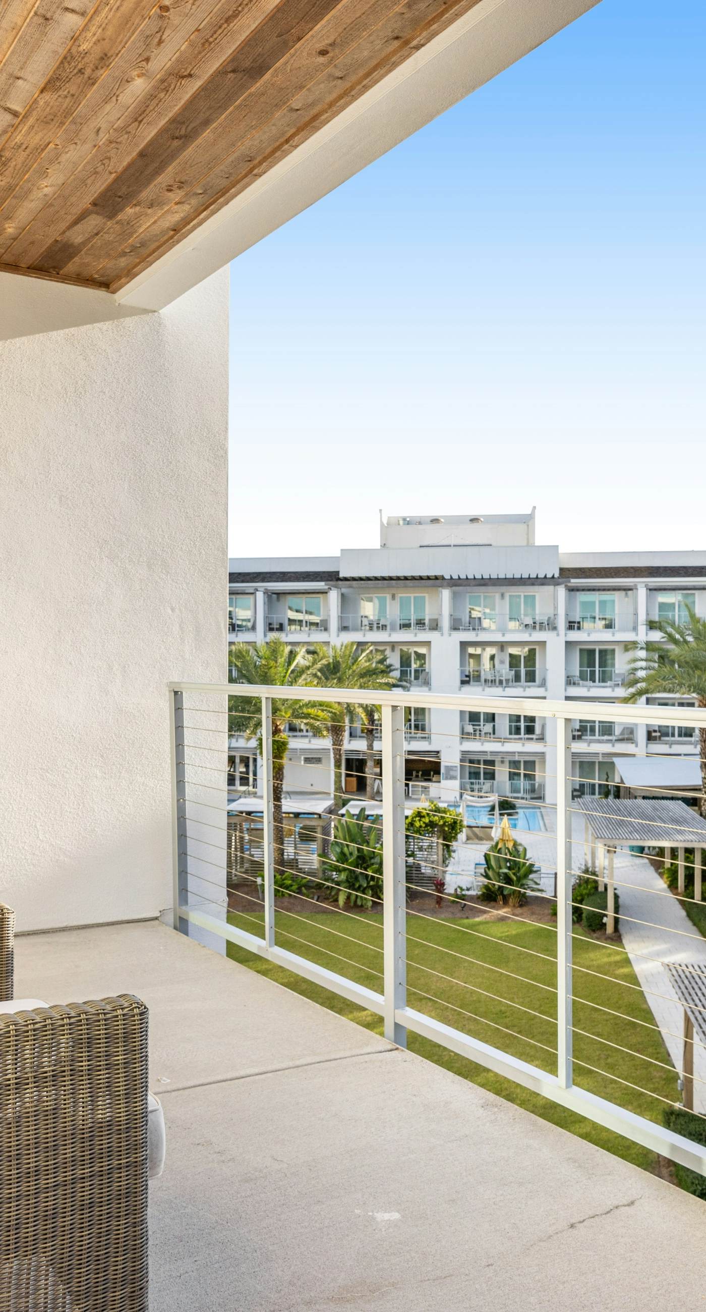 Third-floor luxury condo near beach with resort pool, gym & EV chargers