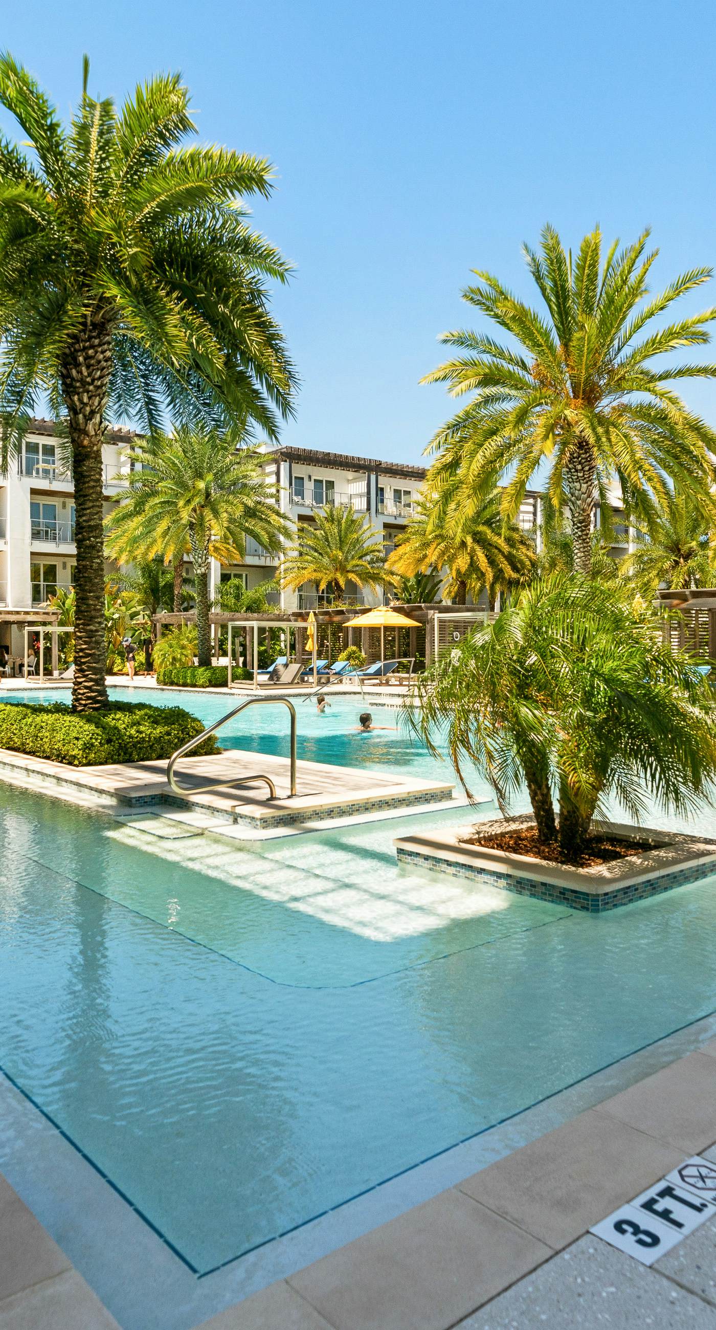 Third-floor luxury condo near beach with resort pool, gym & EV chargers