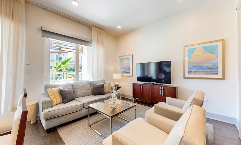 Chic condo steps from beach with patio, W/D, AC, and resort-style pool and gym
