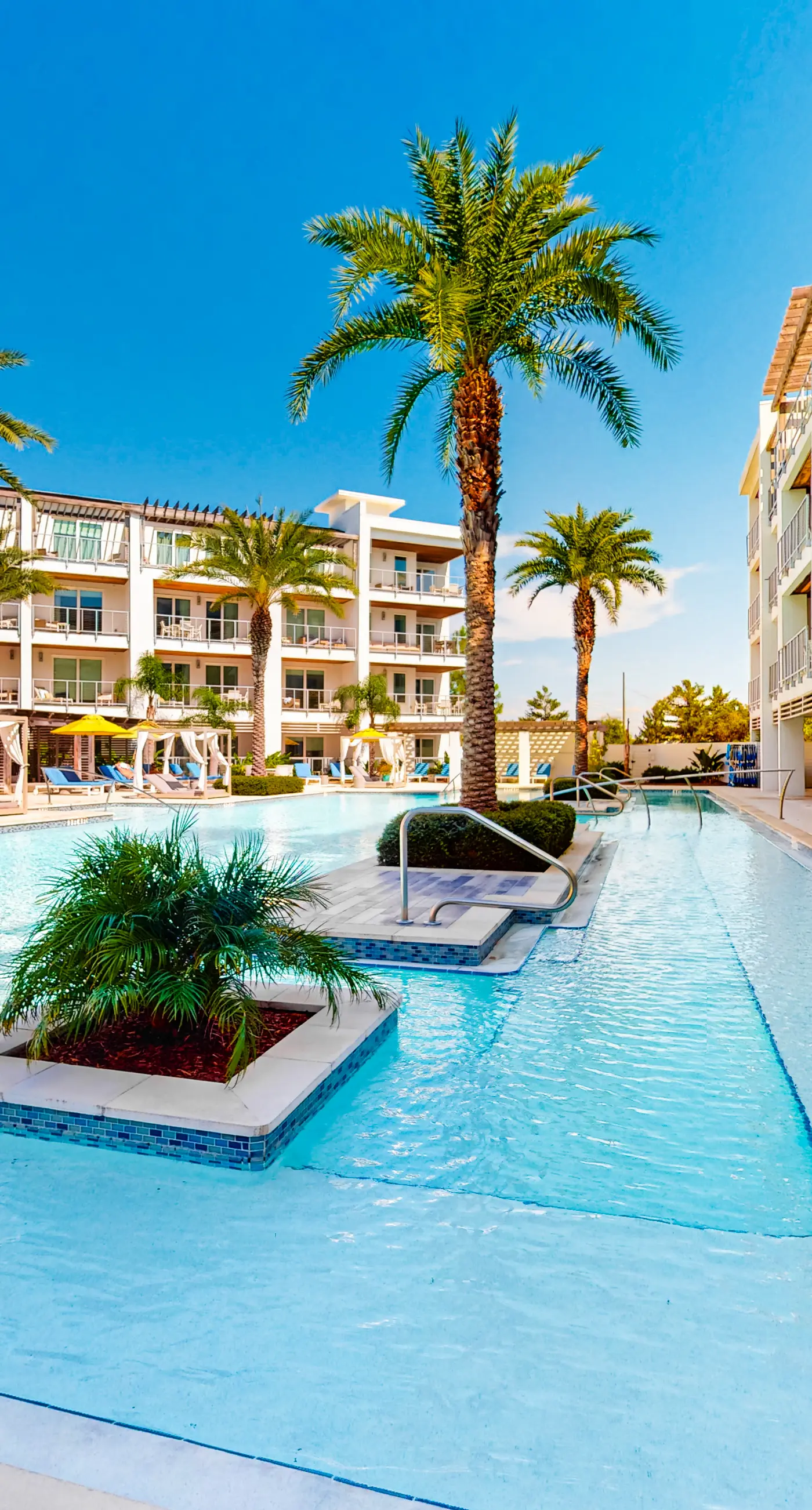 Chic condo steps from beach with patio, W/D, AC, and resort-style pool and gym