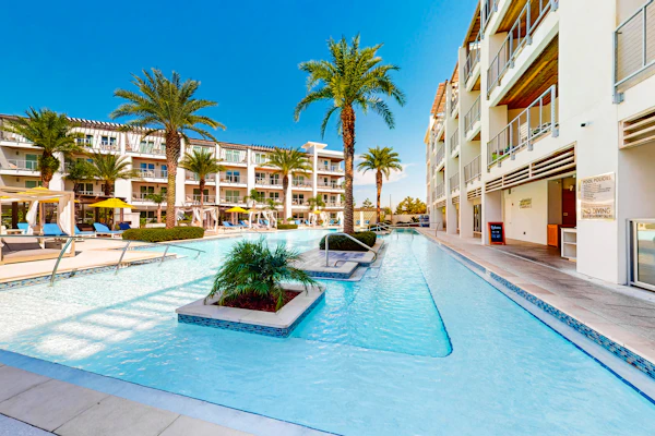 Chic condo steps from beach with patio, W/D, AC, and resort-style pool and gym