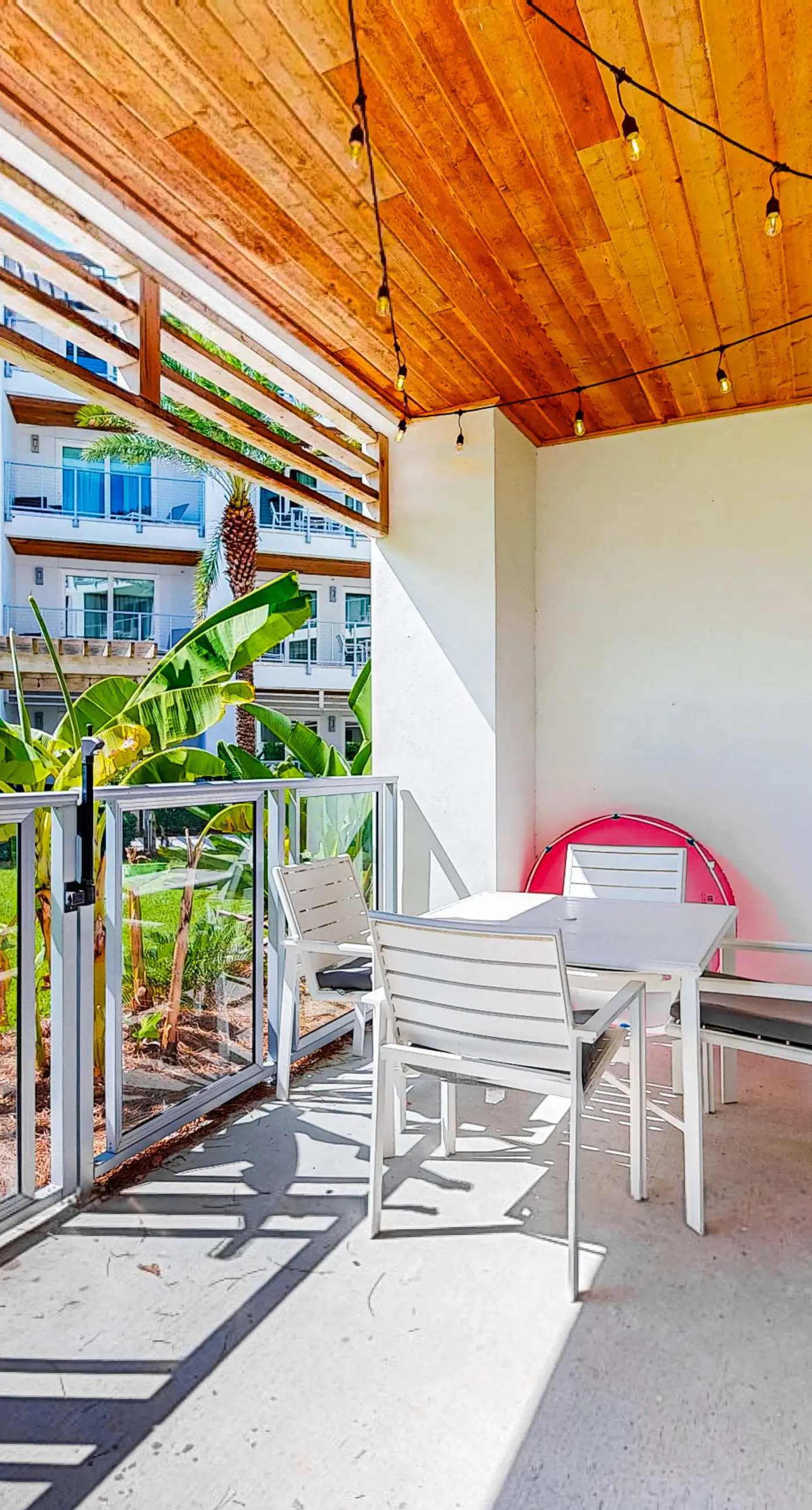Chic condo steps from beach with patio, W/D, AC, and resort-style pool and gym