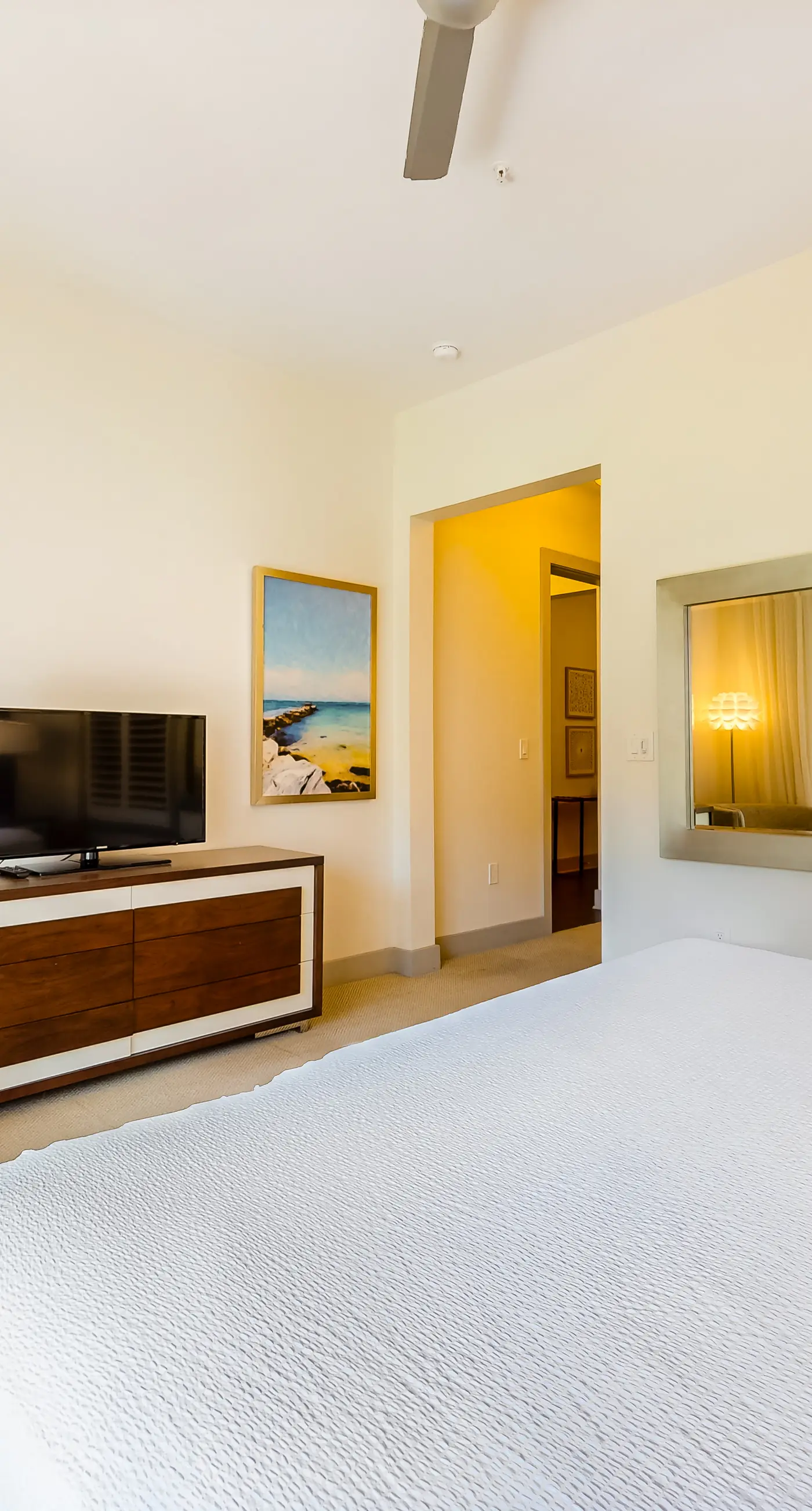 Chic condo steps from beach with patio, W/D, AC, and resort-style pool and gym