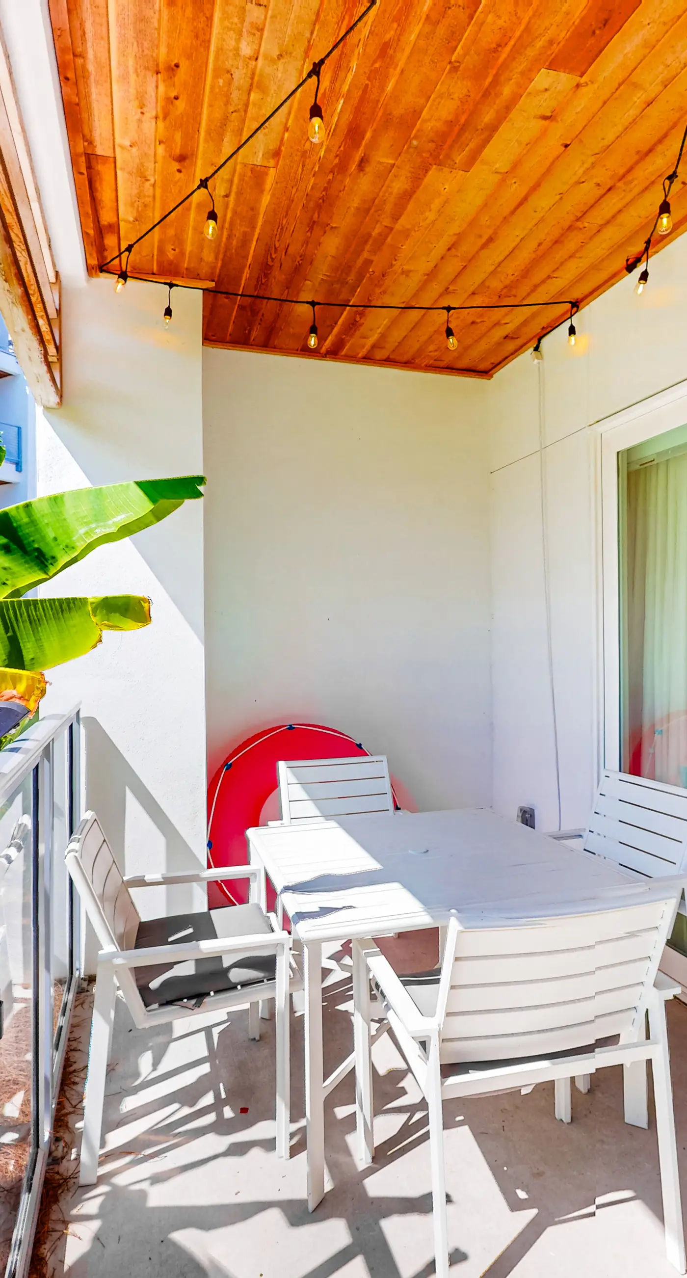 Chic condo steps from beach with patio, W/D, AC, and resort-style pool and gym