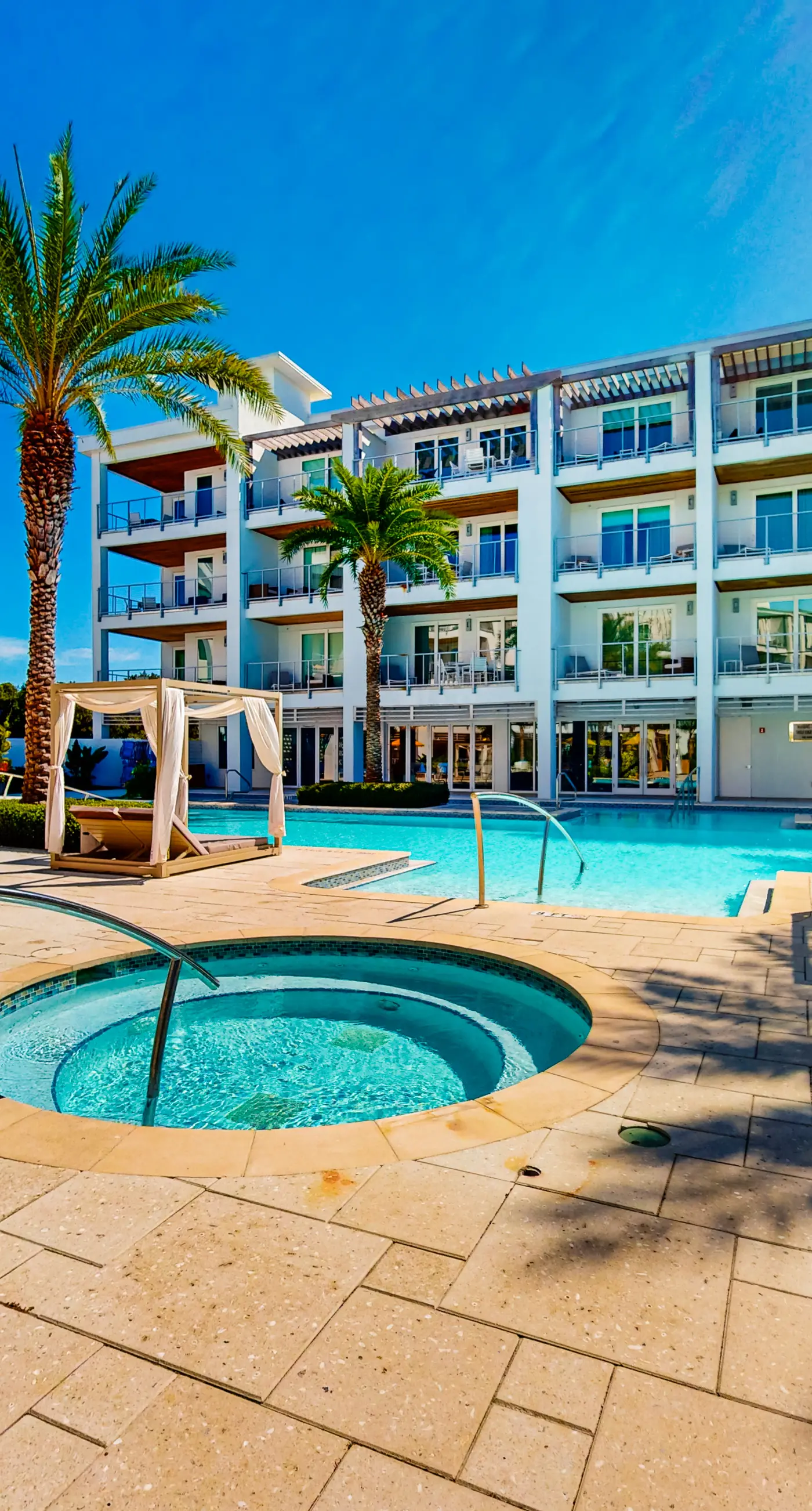 Chic condo steps from beach with patio, W/D, AC, and resort-style pool and gym