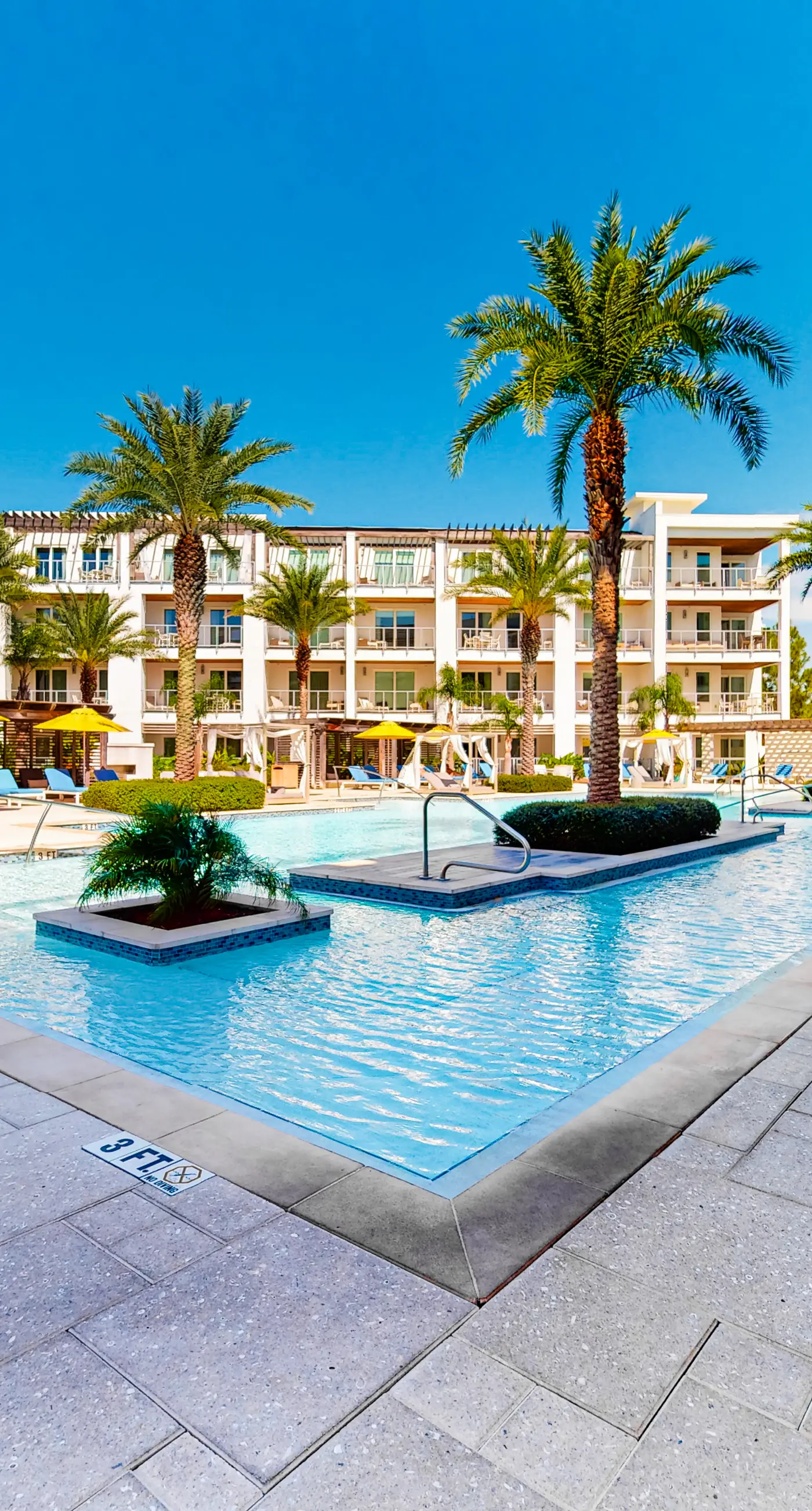 Chic condo steps from beach with patio, W/D, AC, and resort-style pool and gym