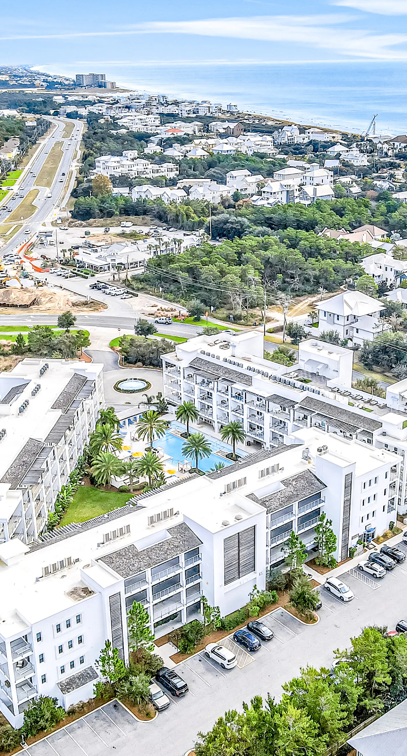 Chic condo steps from beach with patio, W/D, AC, and resort-style pool and gym