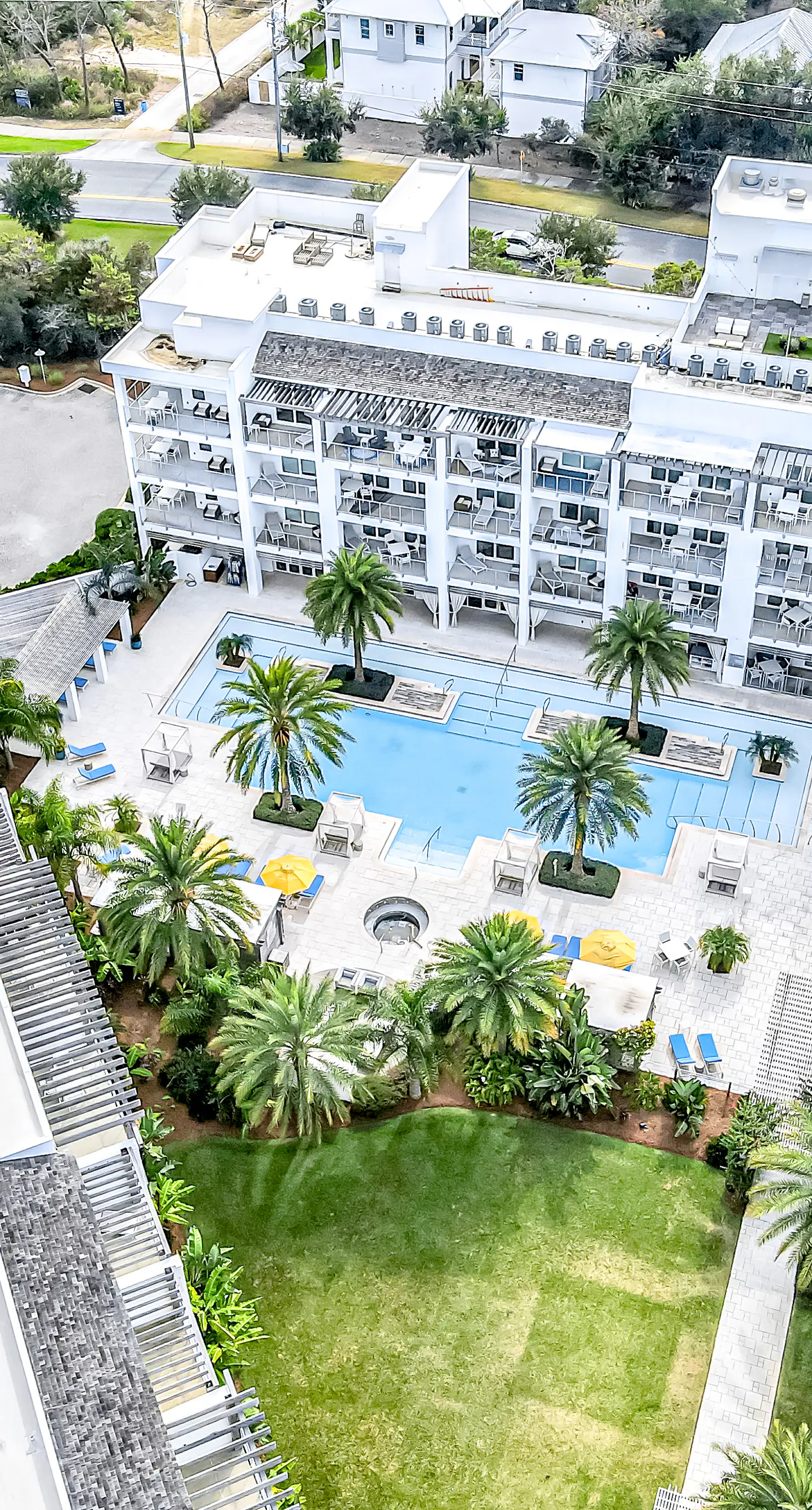 Chic condo steps from beach with patio, W/D, AC, and resort-style pool and gym