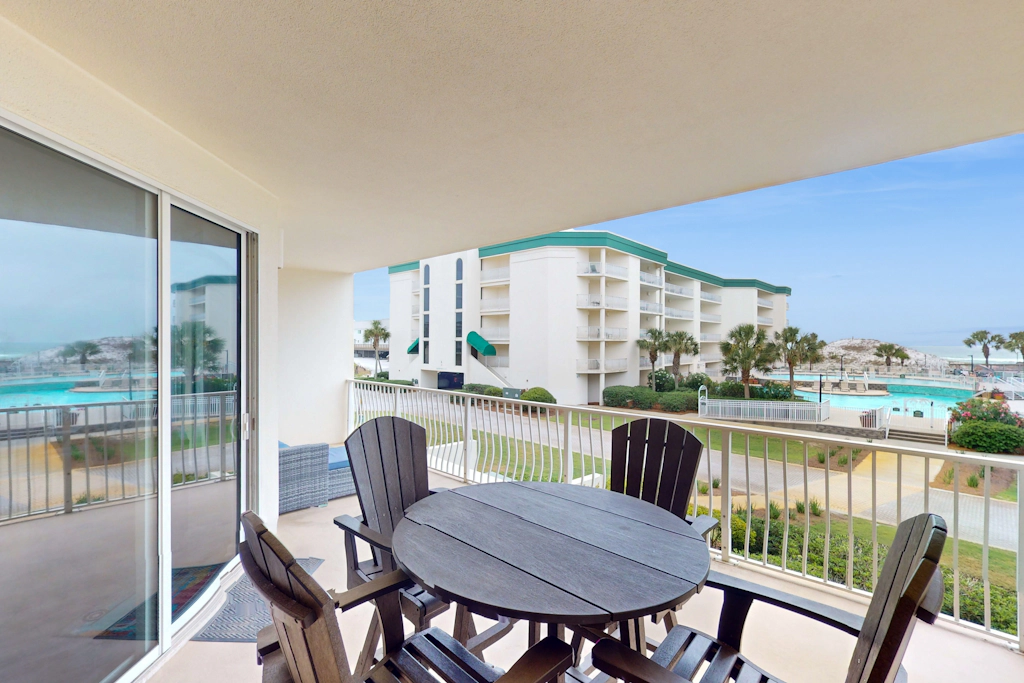 Attractive home with spacious balcony, pool view & pickleball - near beach
