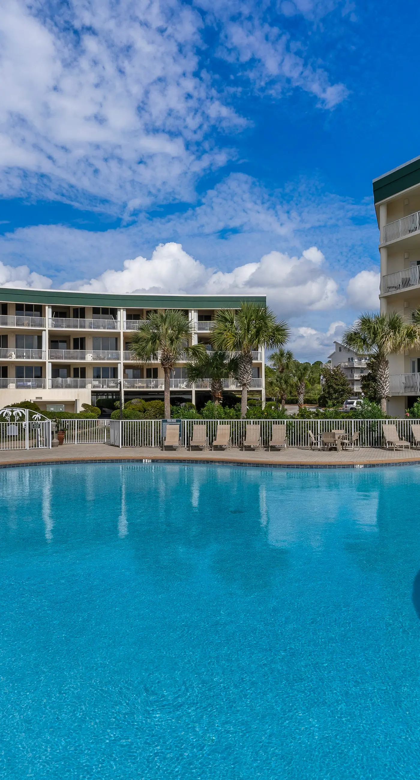 Attractive home with spacious balcony, pool view & pickleball - near beach