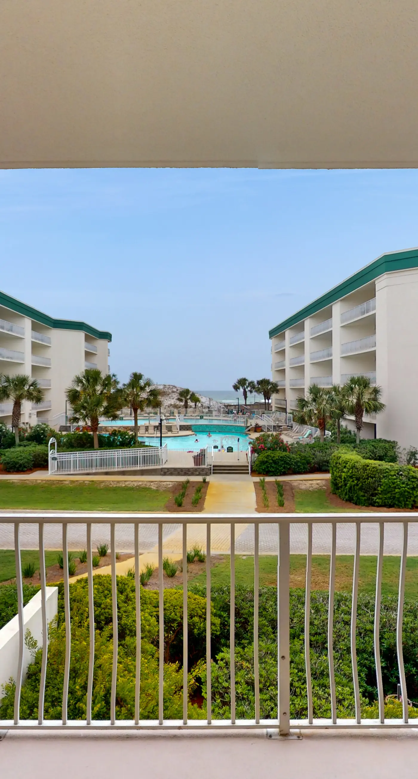 Attractive home with spacious balcony, pool view & pickleball - near beach