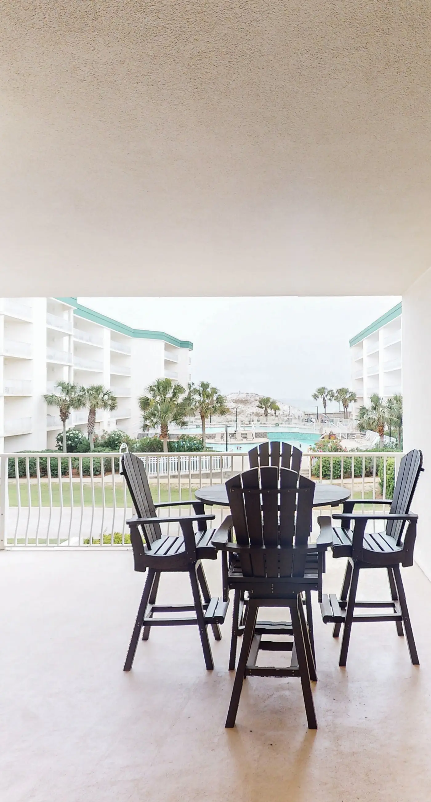 Attractive home with spacious balcony, pool view & pickleball - near beach