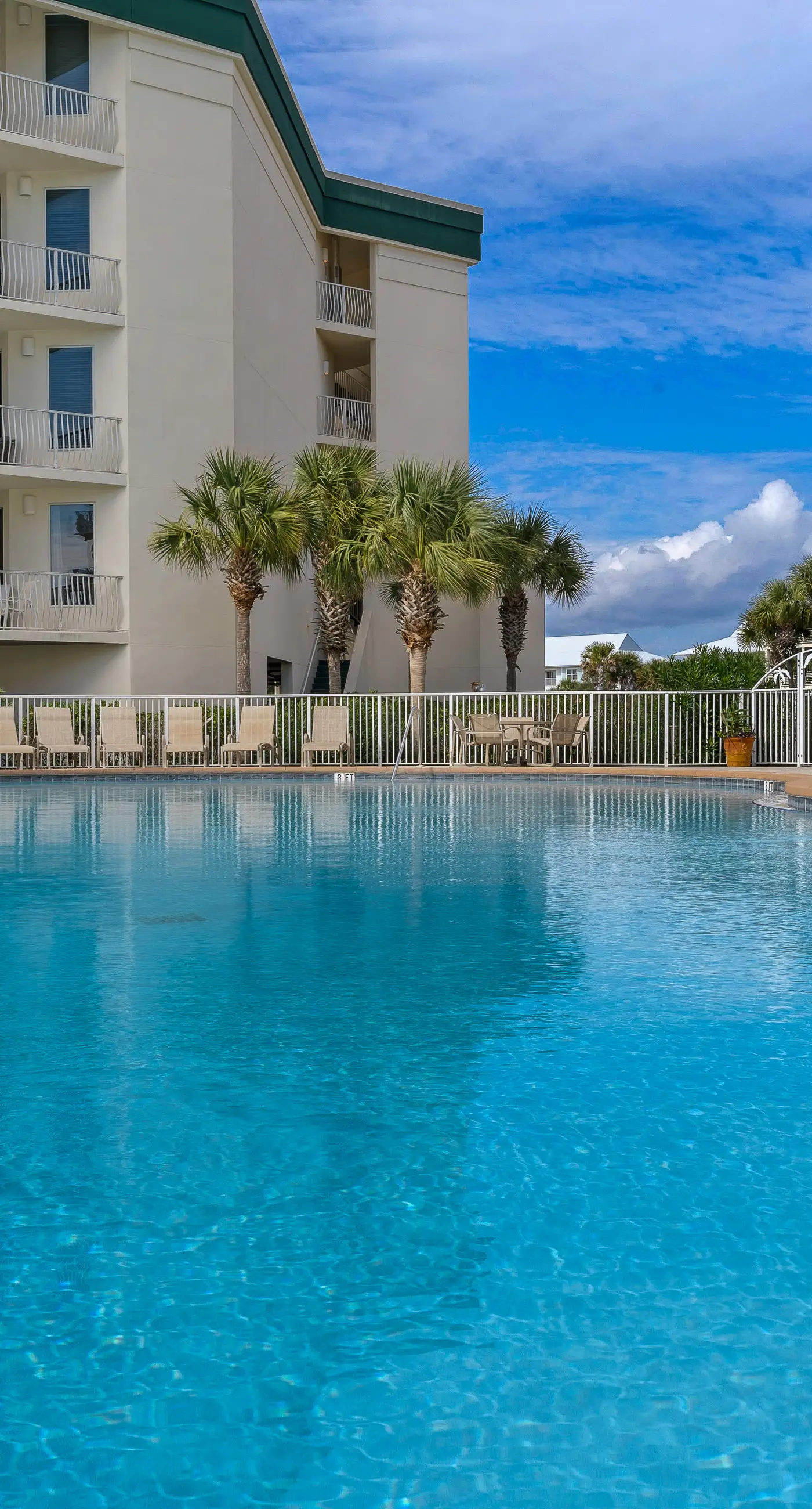 Attractive home with spacious balcony, pool view & pickleball - near beach