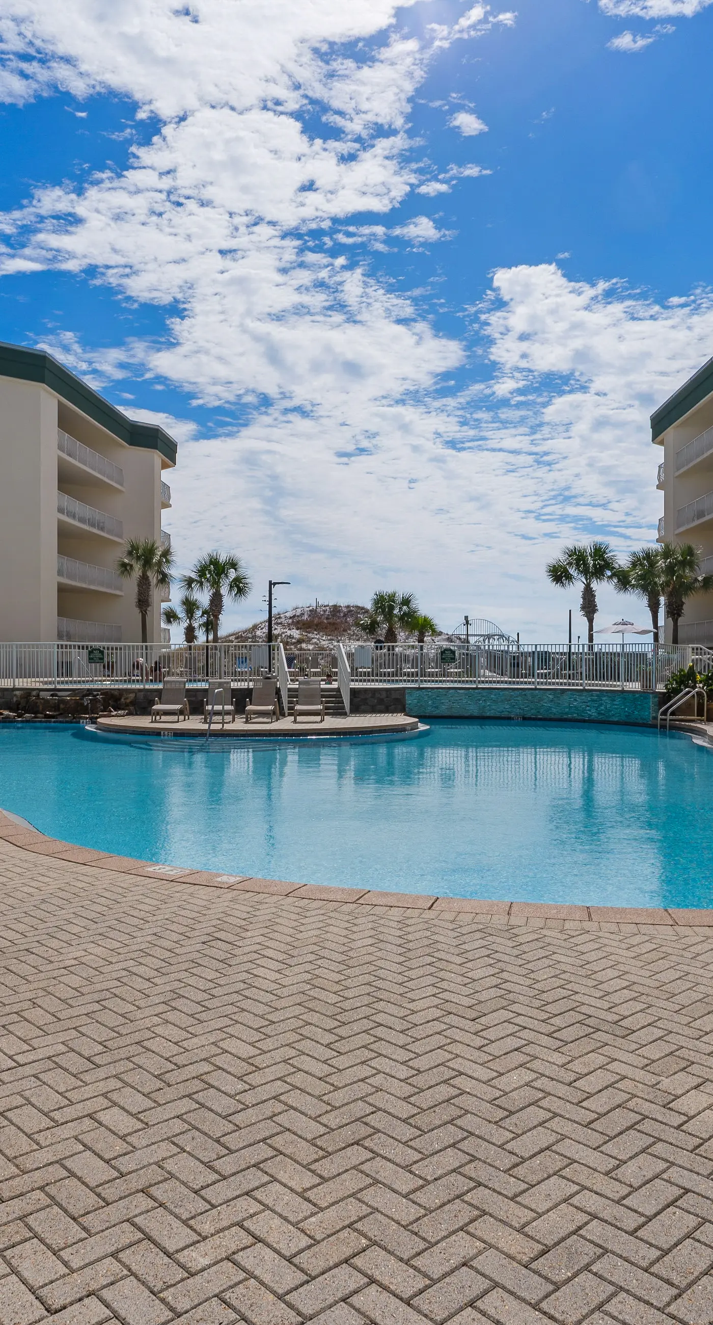 Attractive home with spacious balcony, pool view & pickleball - near beach