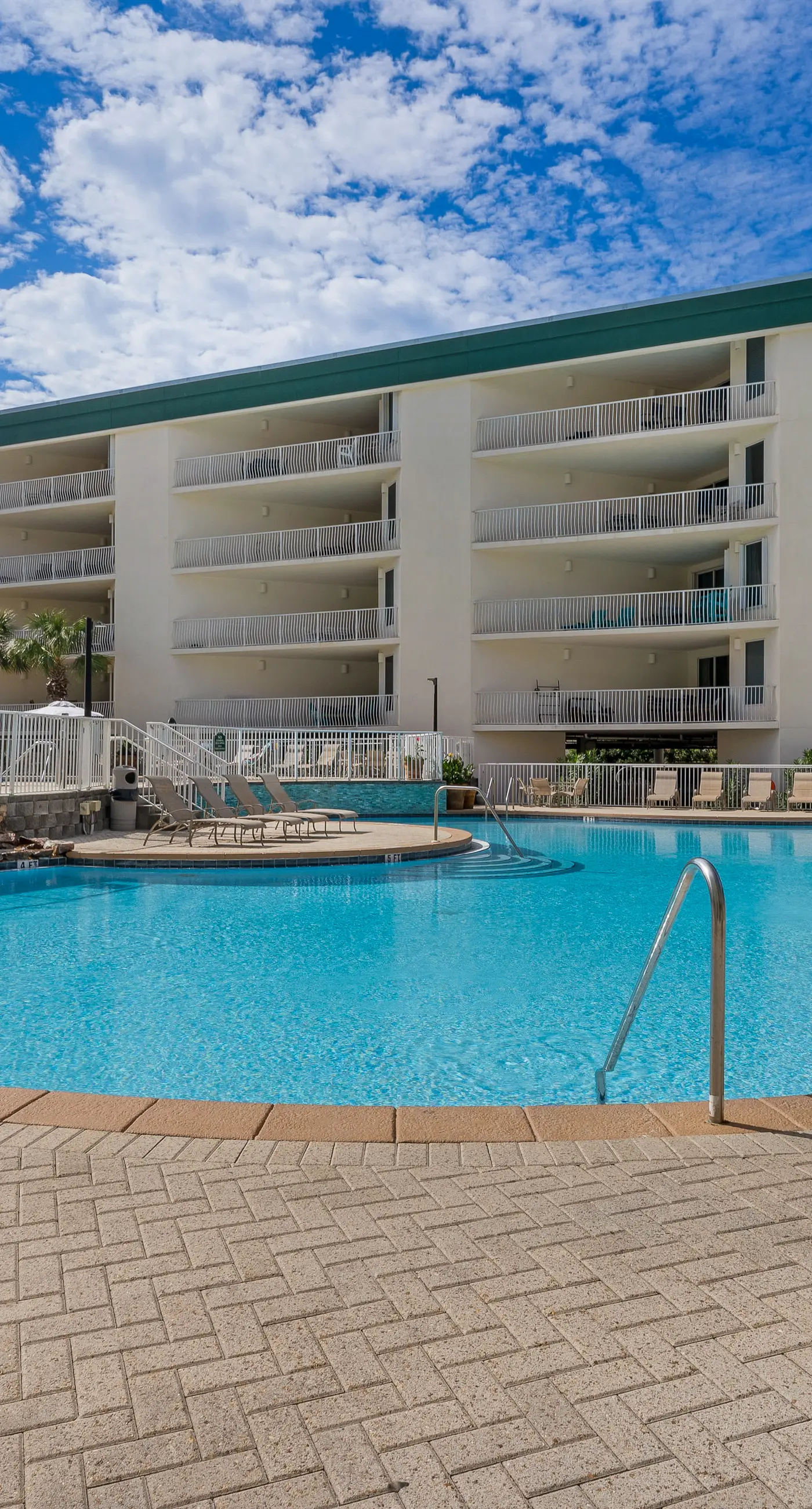 Attractive home with spacious balcony, pool view & pickleball - near beach