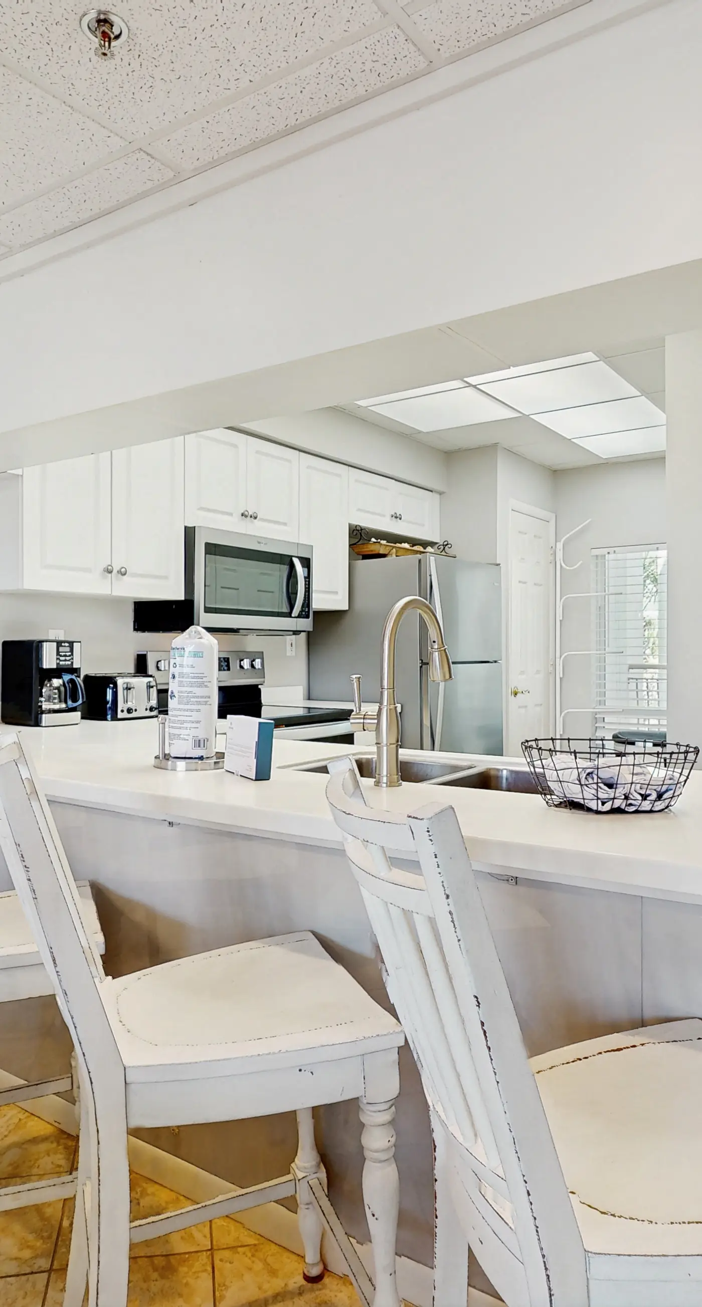 Airy beachfront condo with balcony views, lagoon pool, tennis & pickleball