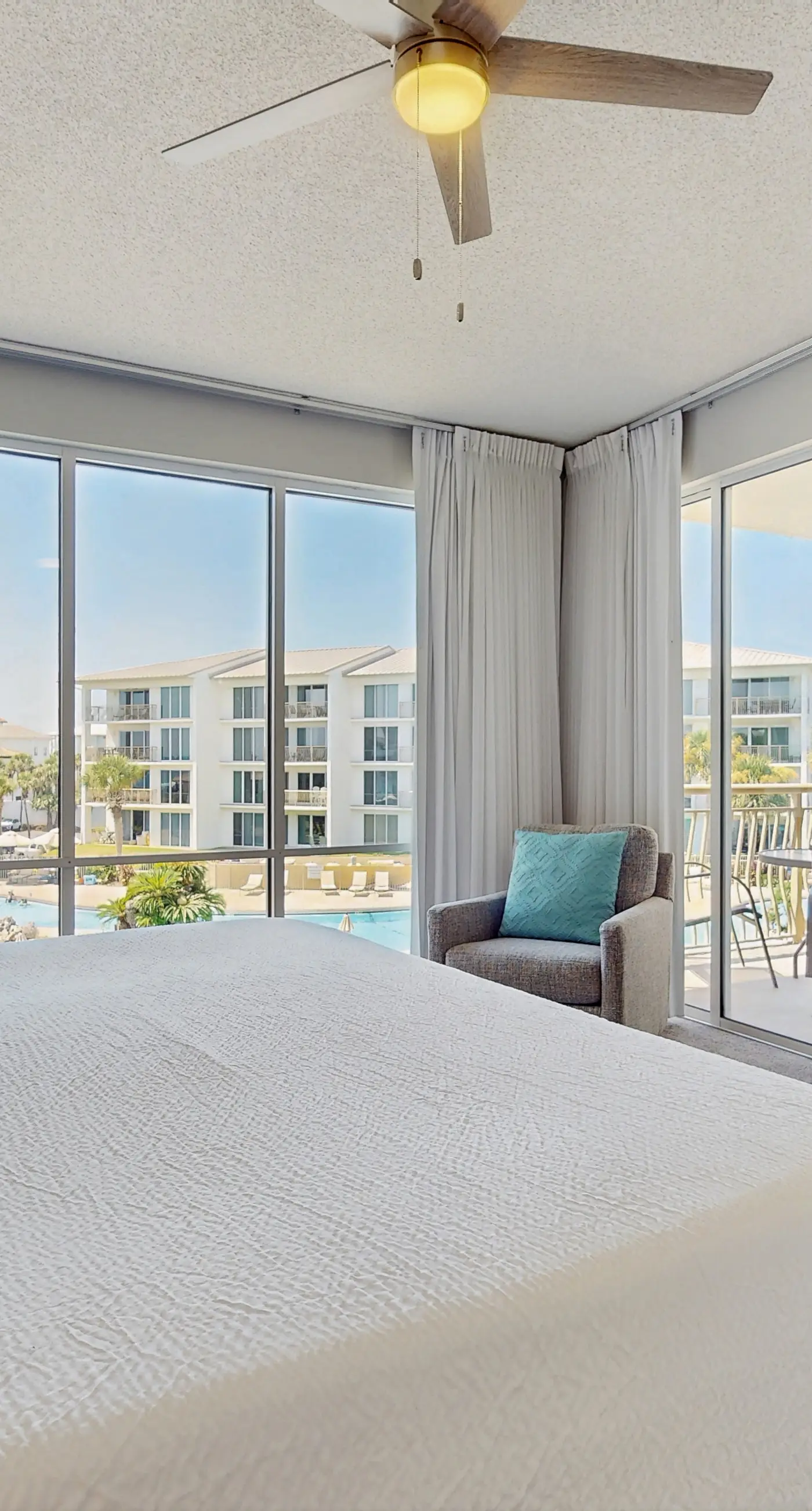 Airy beachfront condo with balcony views, lagoon pool, tennis & pickleball