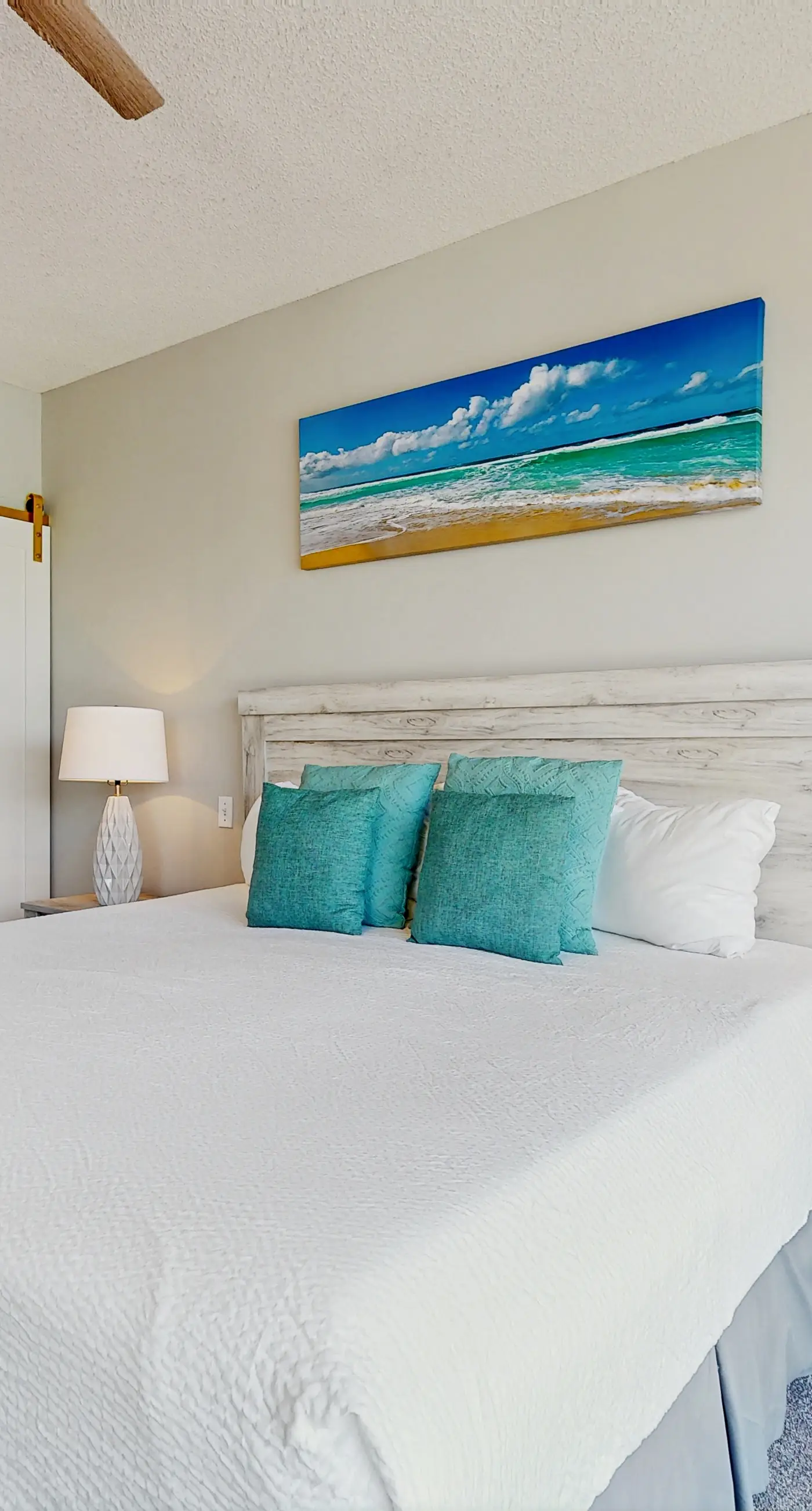 Airy beachfront condo with balcony views, lagoon pool, tennis & pickleball