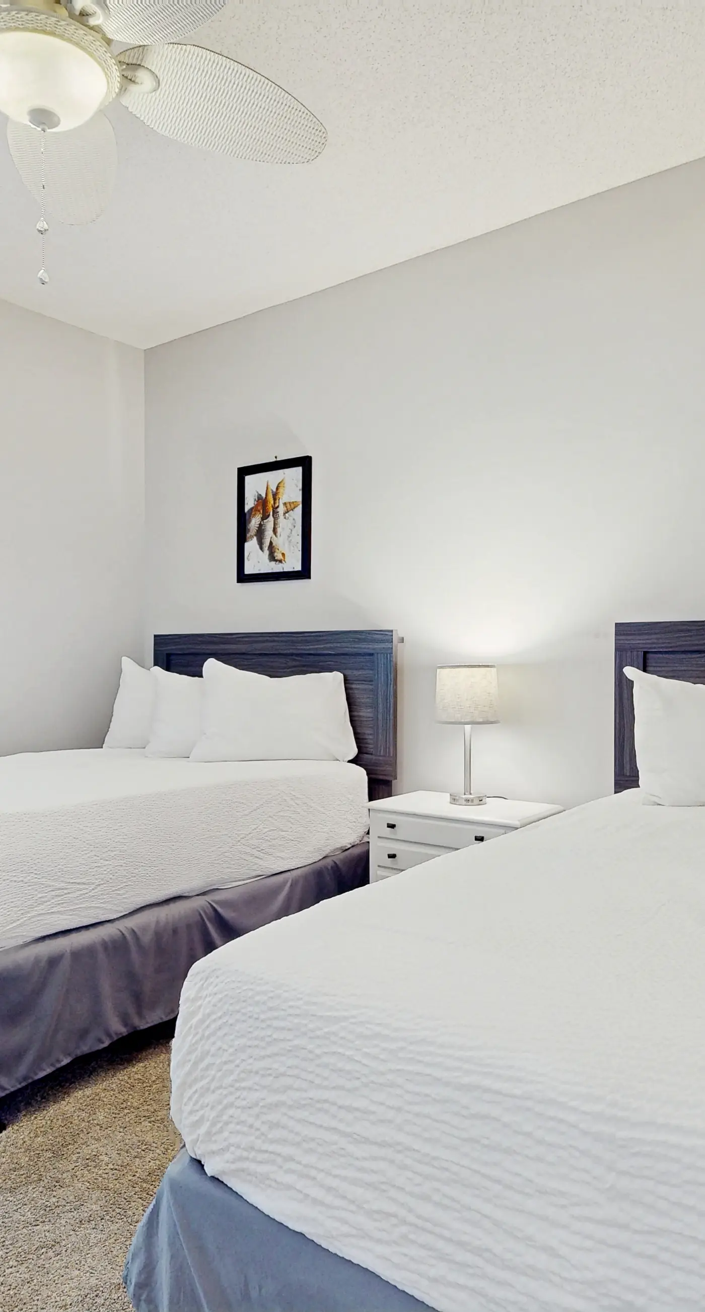 Airy beachfront condo with balcony views, lagoon pool, tennis & pickleball