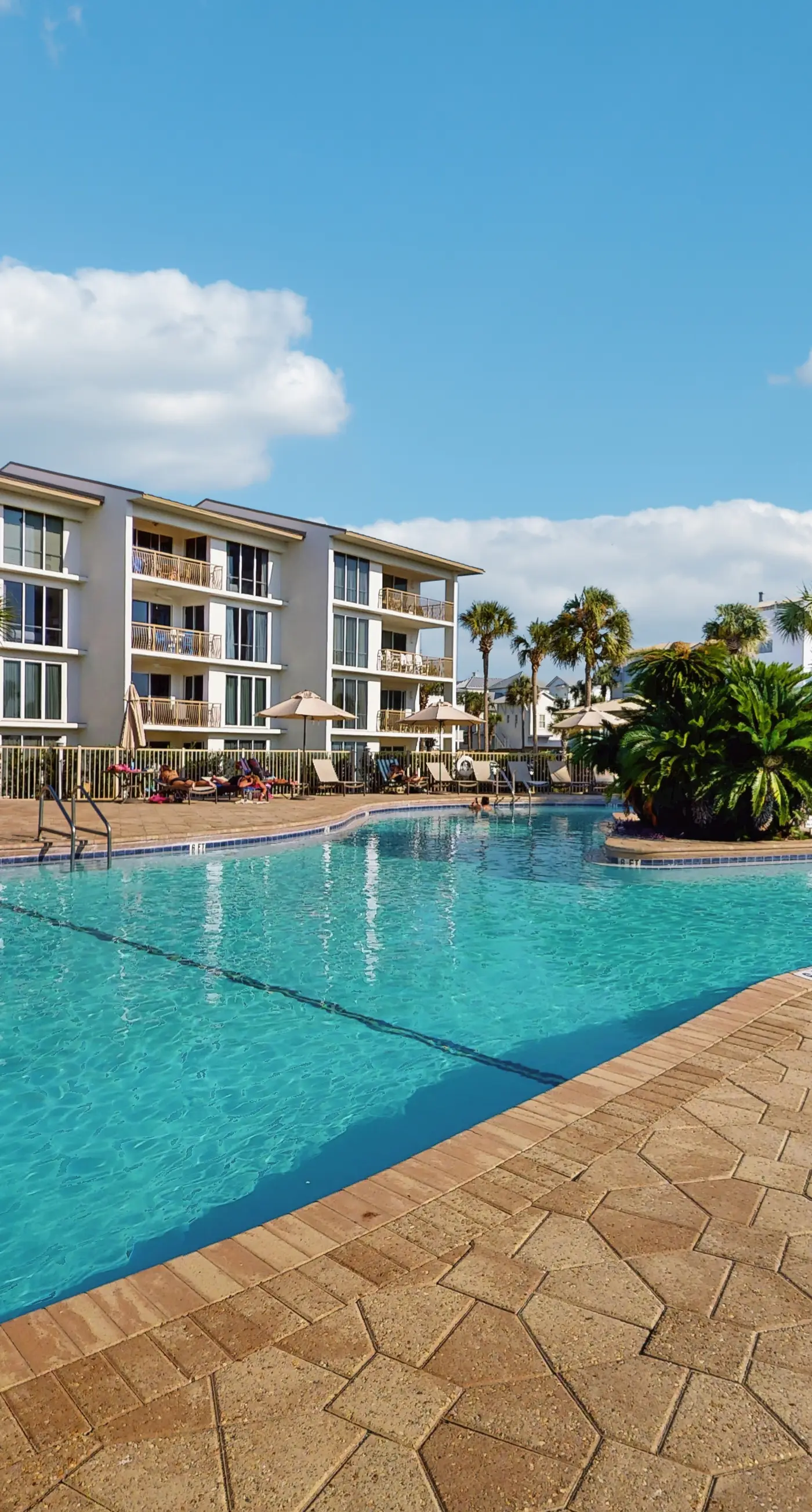 Airy beachfront condo with balcony views, lagoon pool, tennis & pickleball