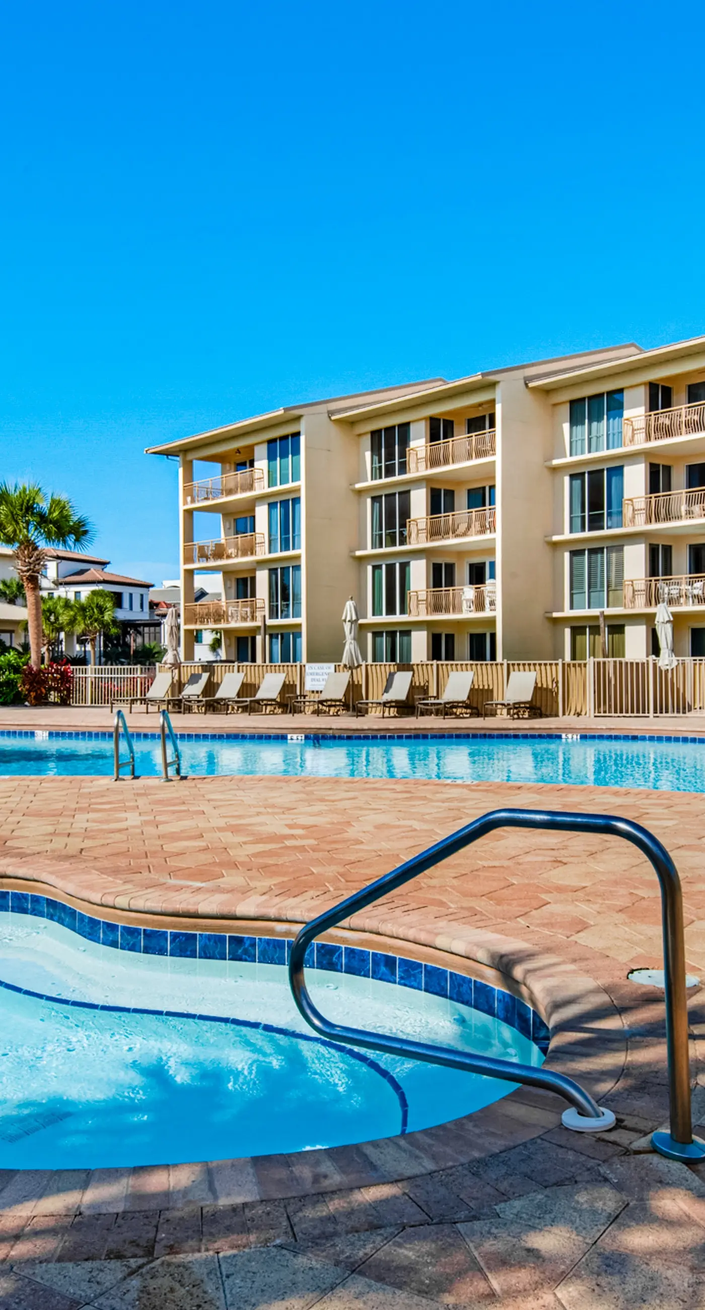 Airy beachfront condo with balcony views, lagoon pool, tennis & pickleball