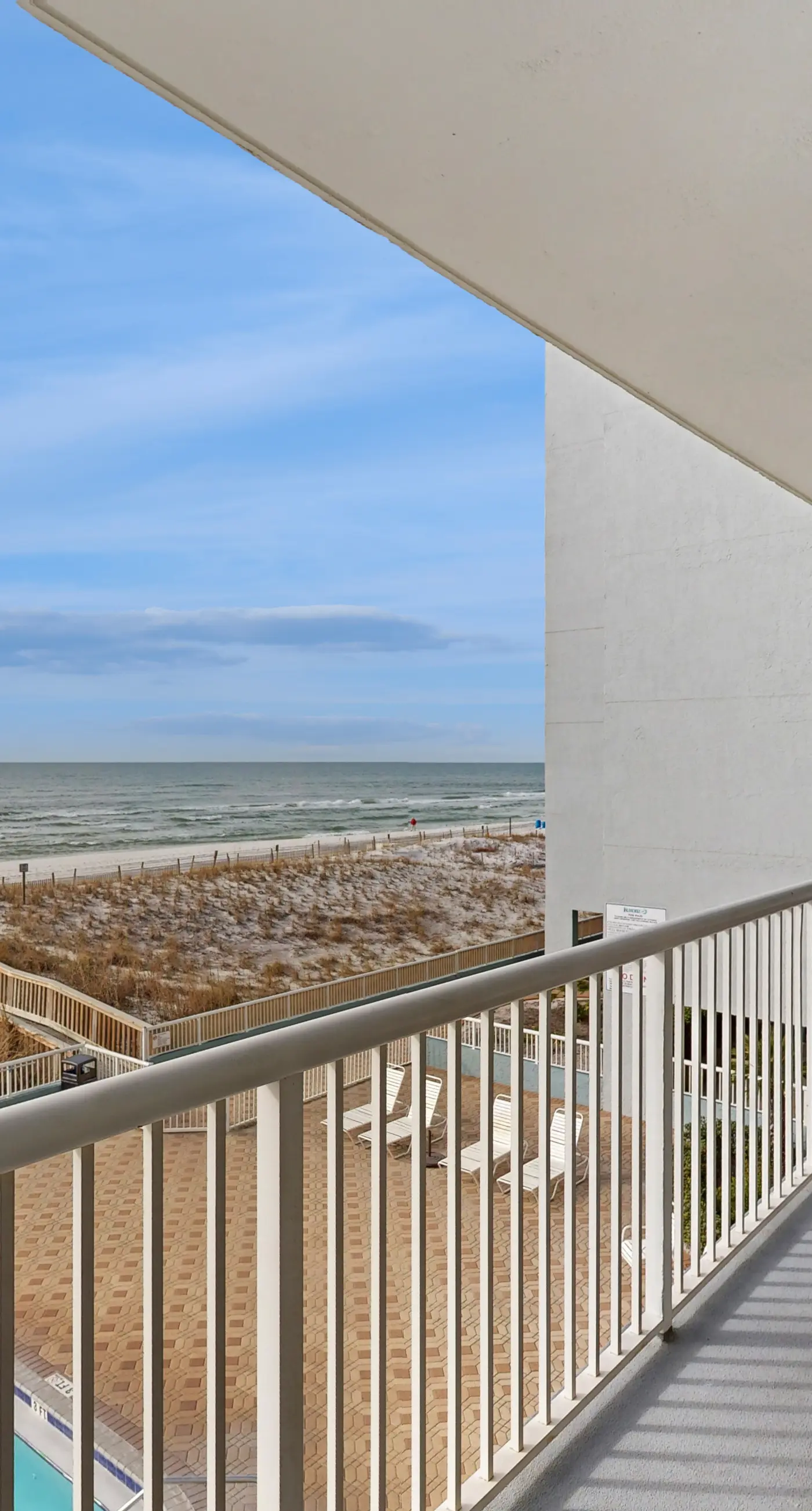 Third floor oceanfront condo with ocean view, pool access, and central AC