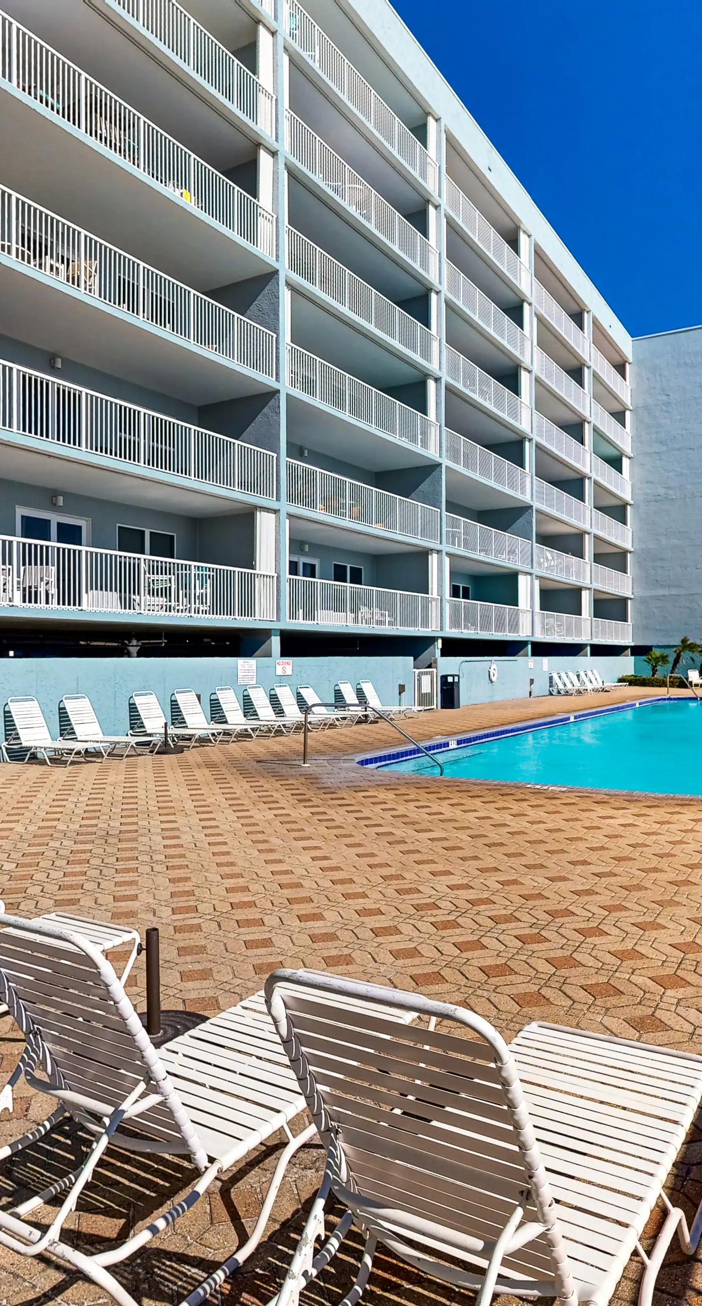 Third floor oceanfront condo with ocean view, pool access, and central AC